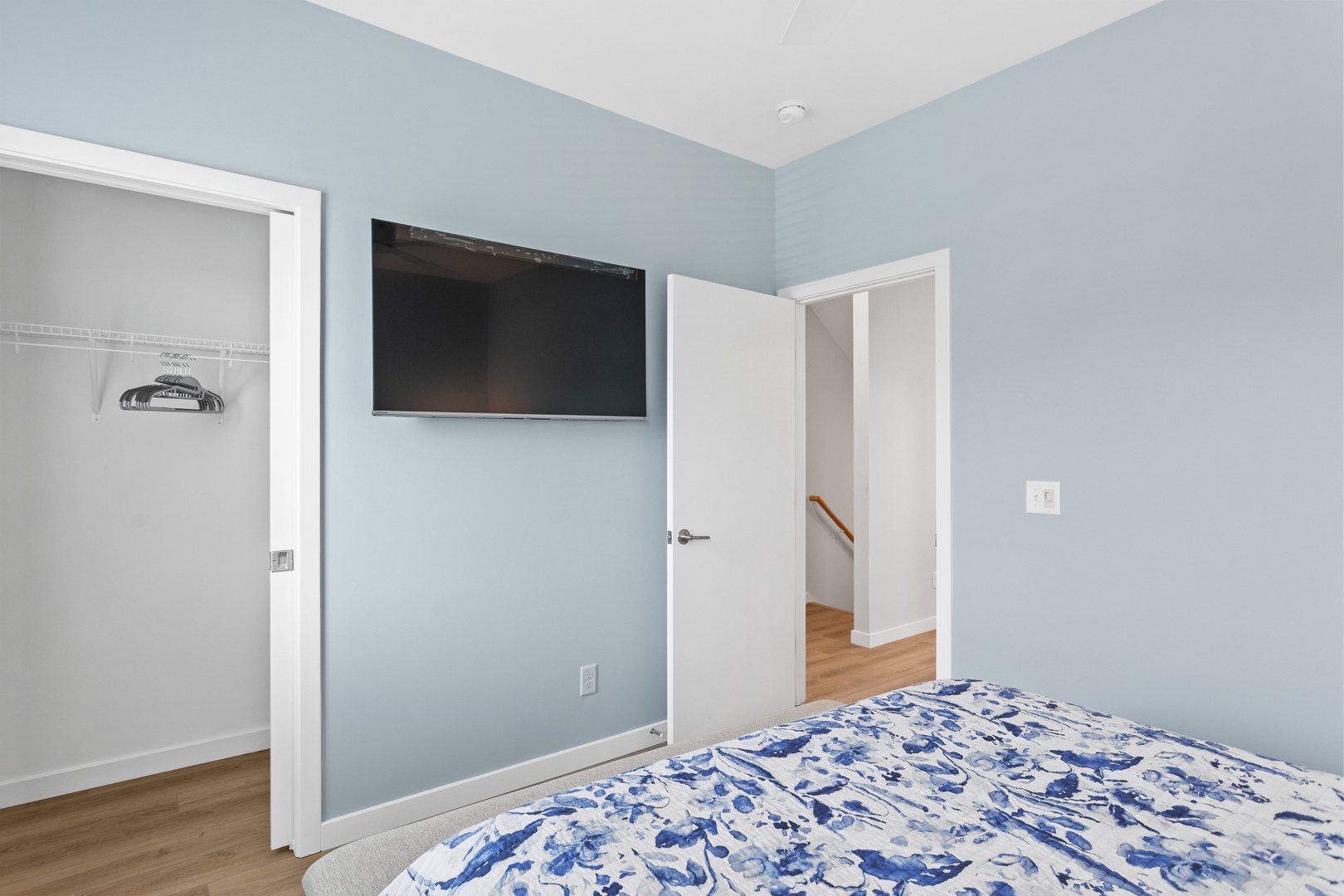 Guest bedroom with a queen-sized bed and Smart TV