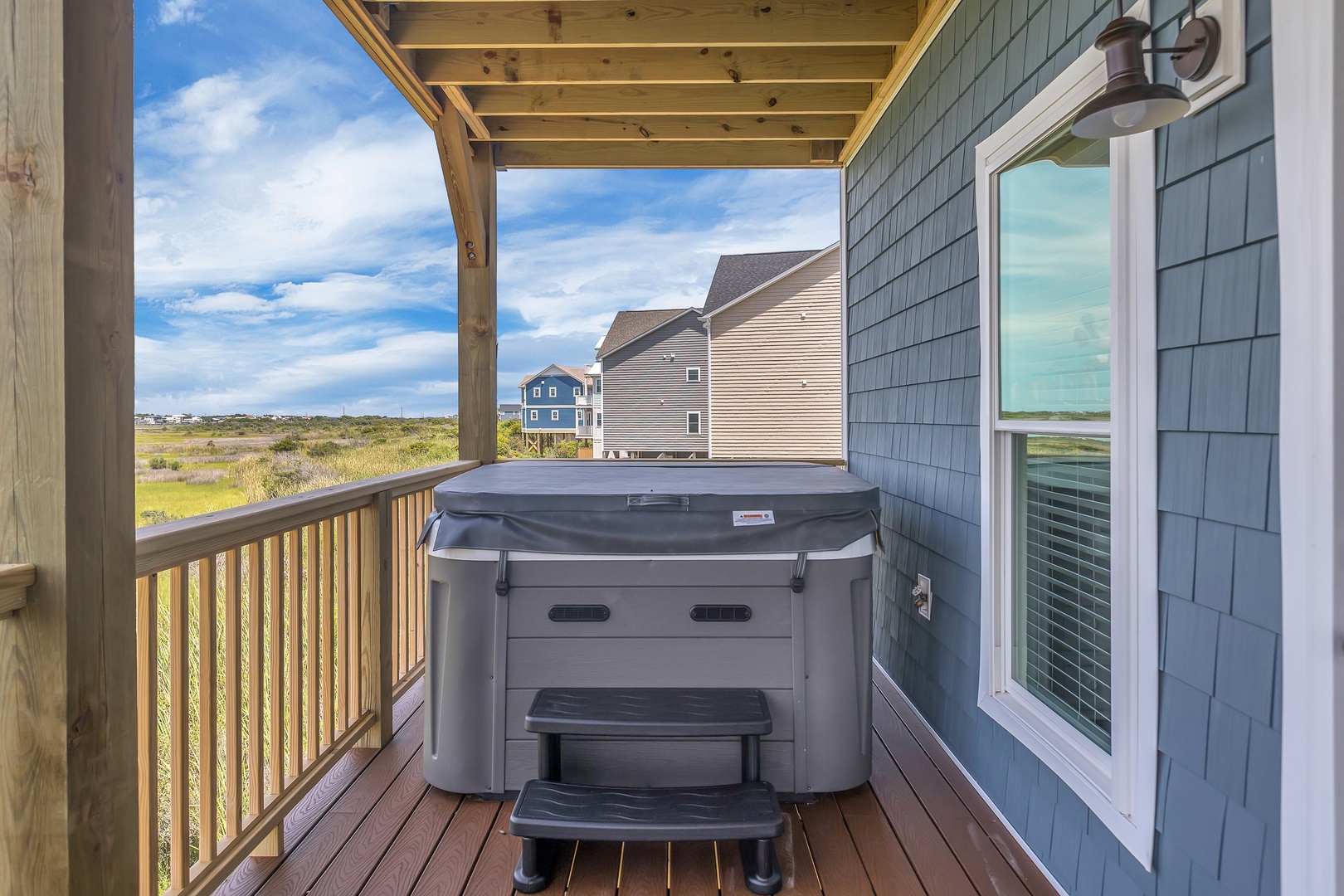 The hot tub on the covered balcony