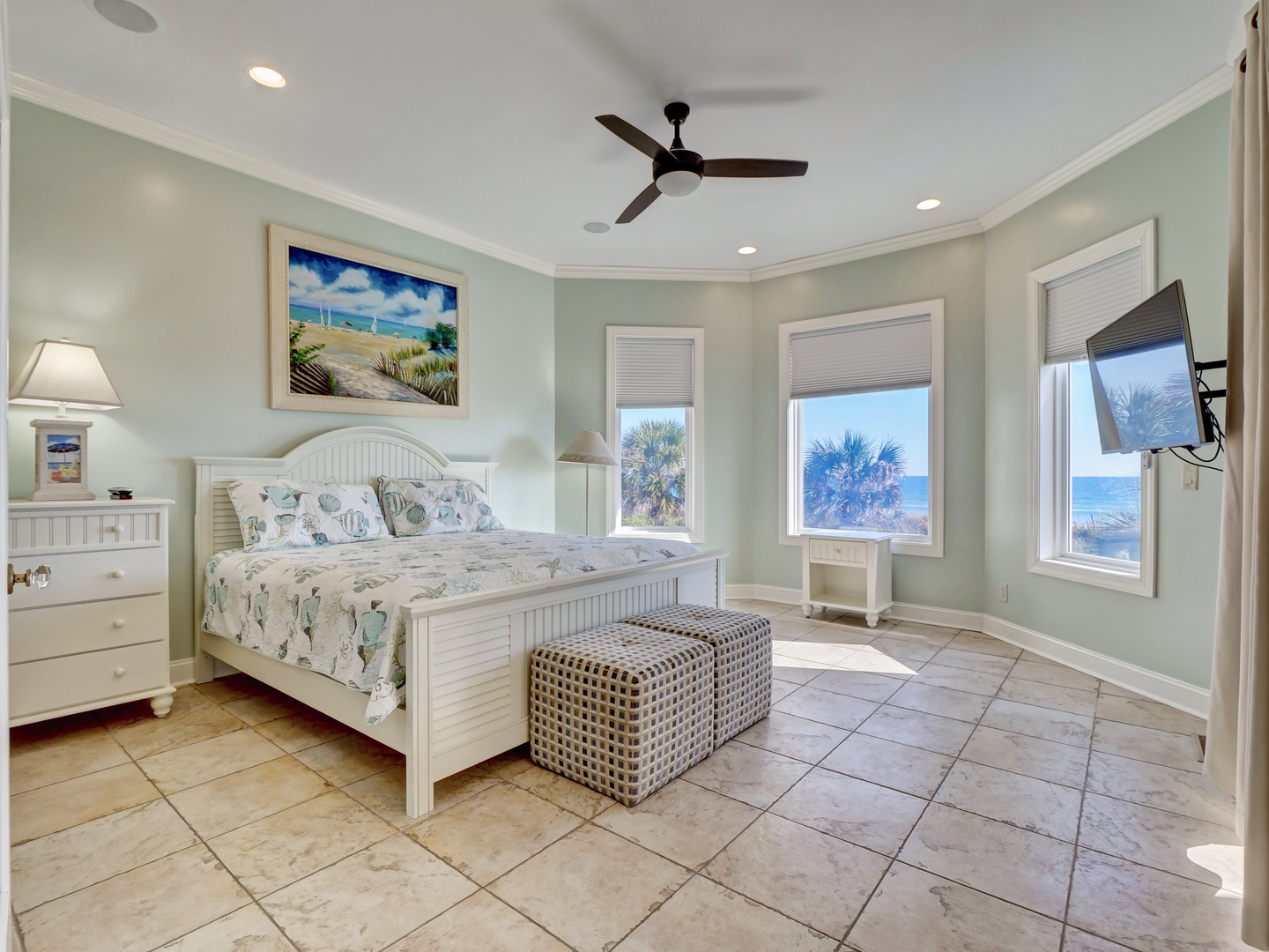 Bedroom with a king-sized bed, flat-screen TV, jack and jill bathroom, and beautiful ocean views