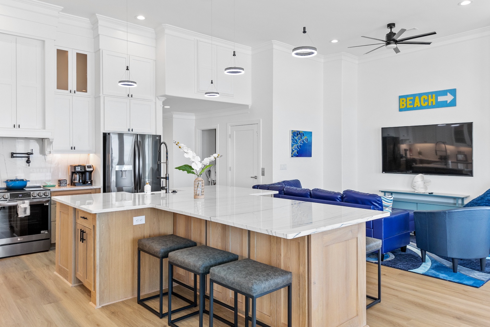 The well-stocked kitchen with countertop seating for 6
