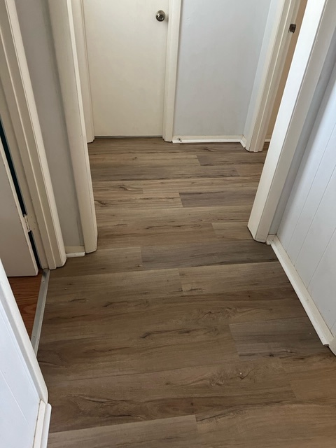 215 hallway 2 showing new flooring