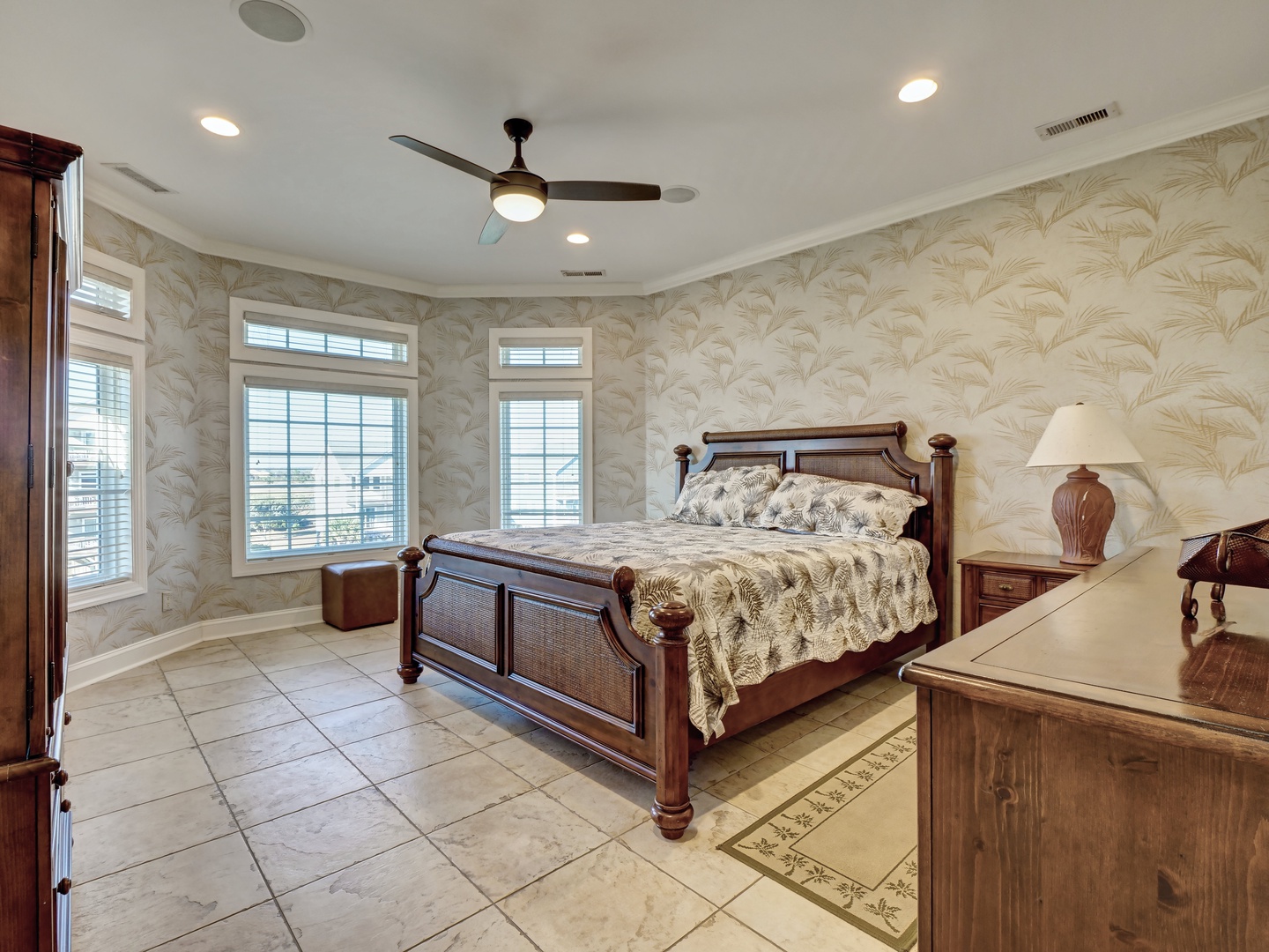 A third floor guest bedroom with a king-sized bed