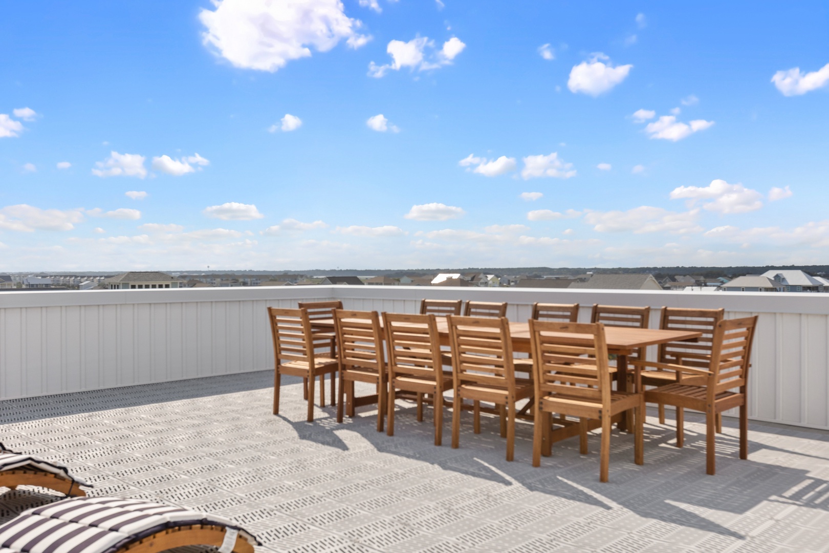 The top level sun deck with dining for 10