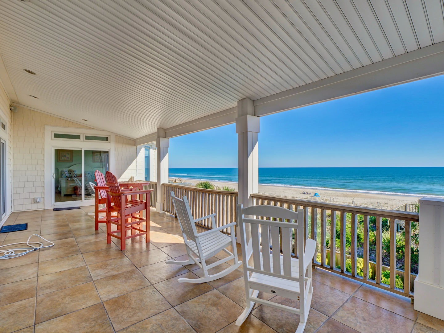 The oceanfront covered porch with fantastic views