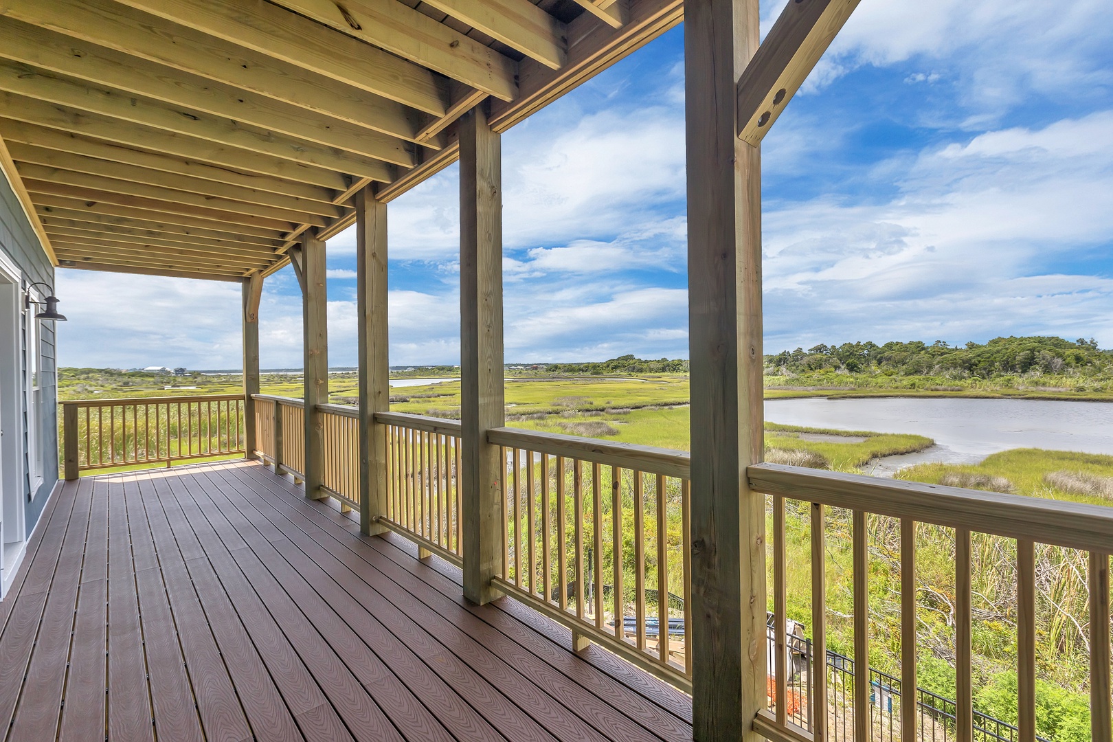 The covered second level balcony with estuary views