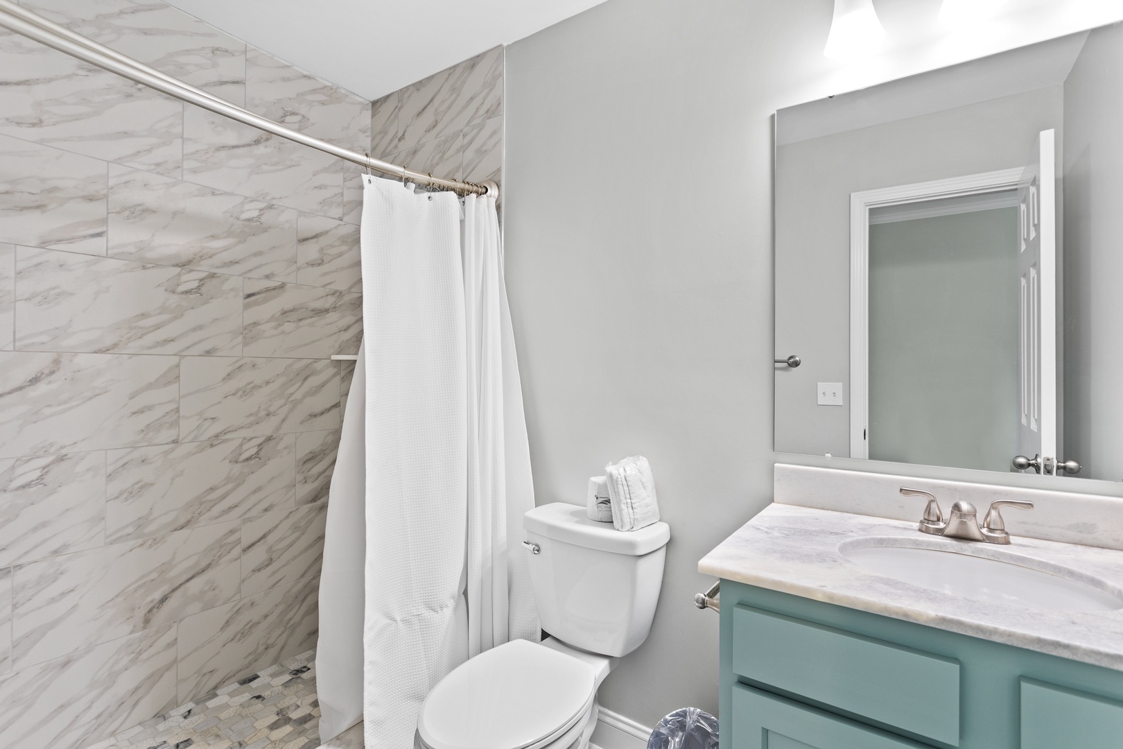 The primary ensuite bathroom with a walk-in shower
