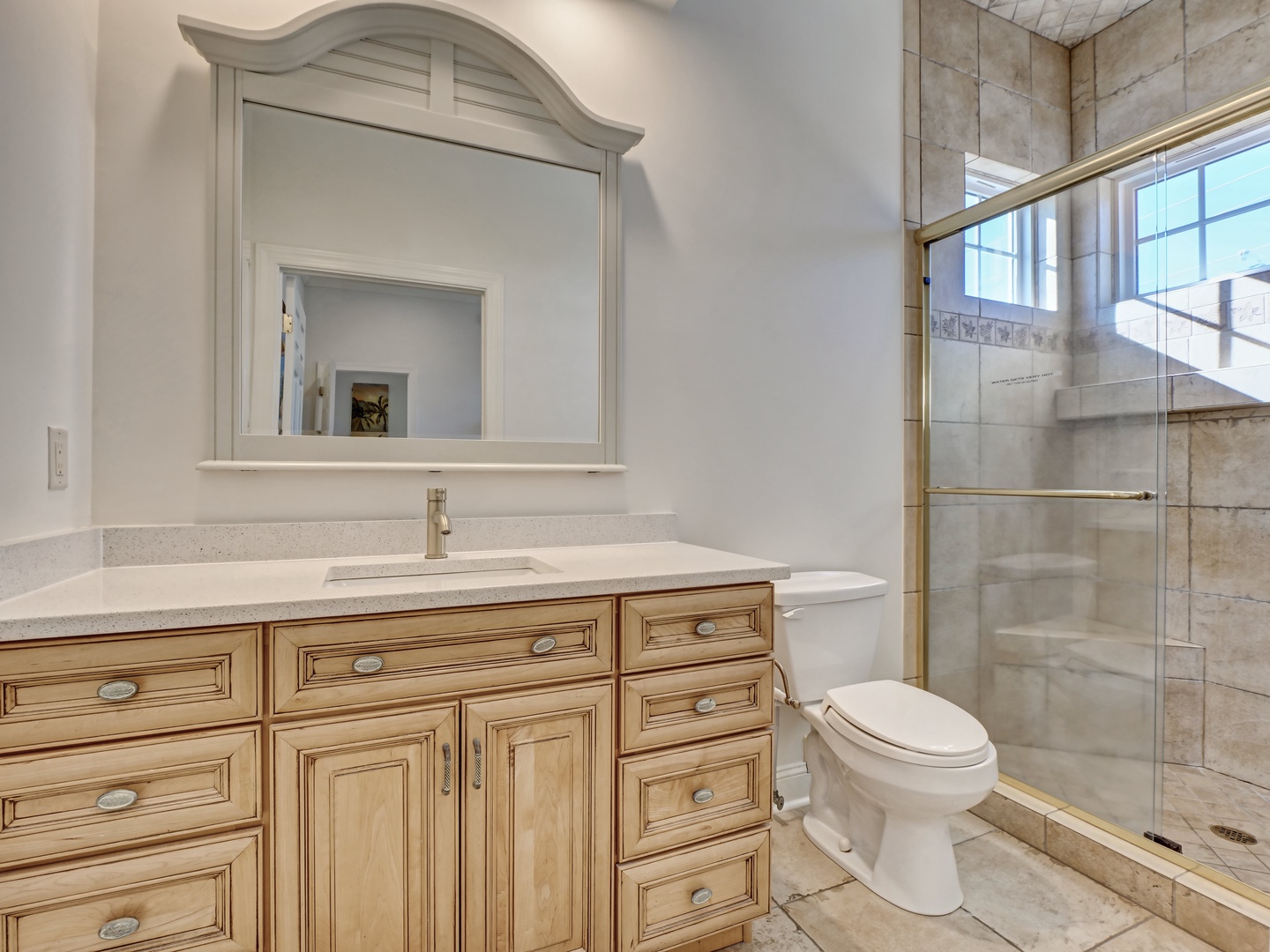 An ensuite bathroom with a walk-in shower
