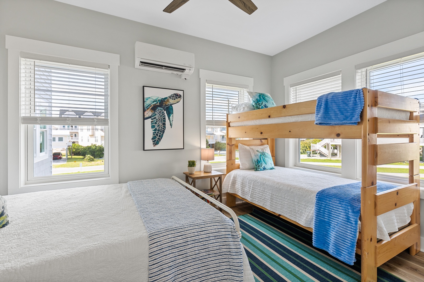 Bedroom 3 offers a full bed, a twin bunk bed, and a Smart TV