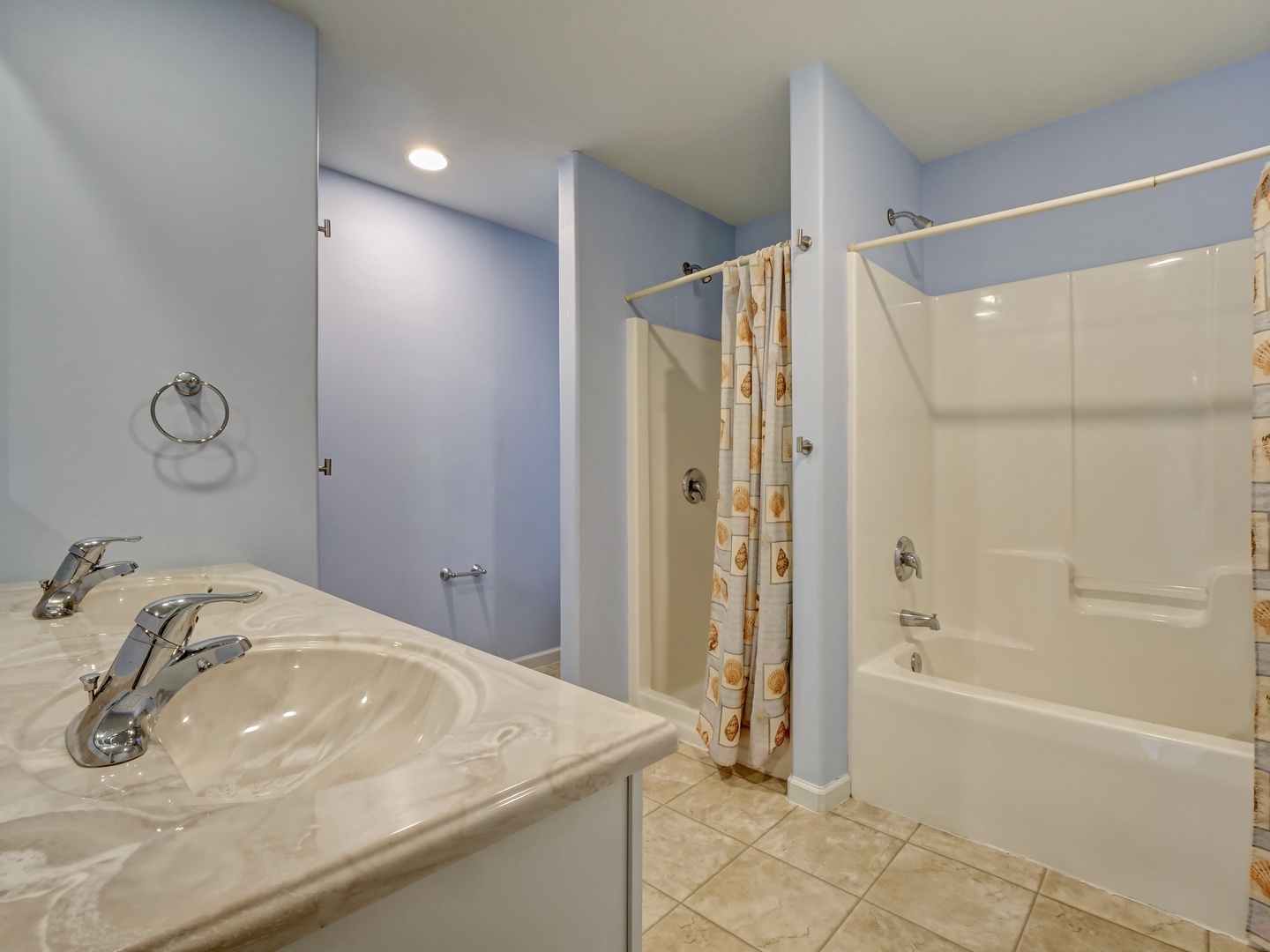 First level shared bathroom with a walk-in shower and shower-tub combination