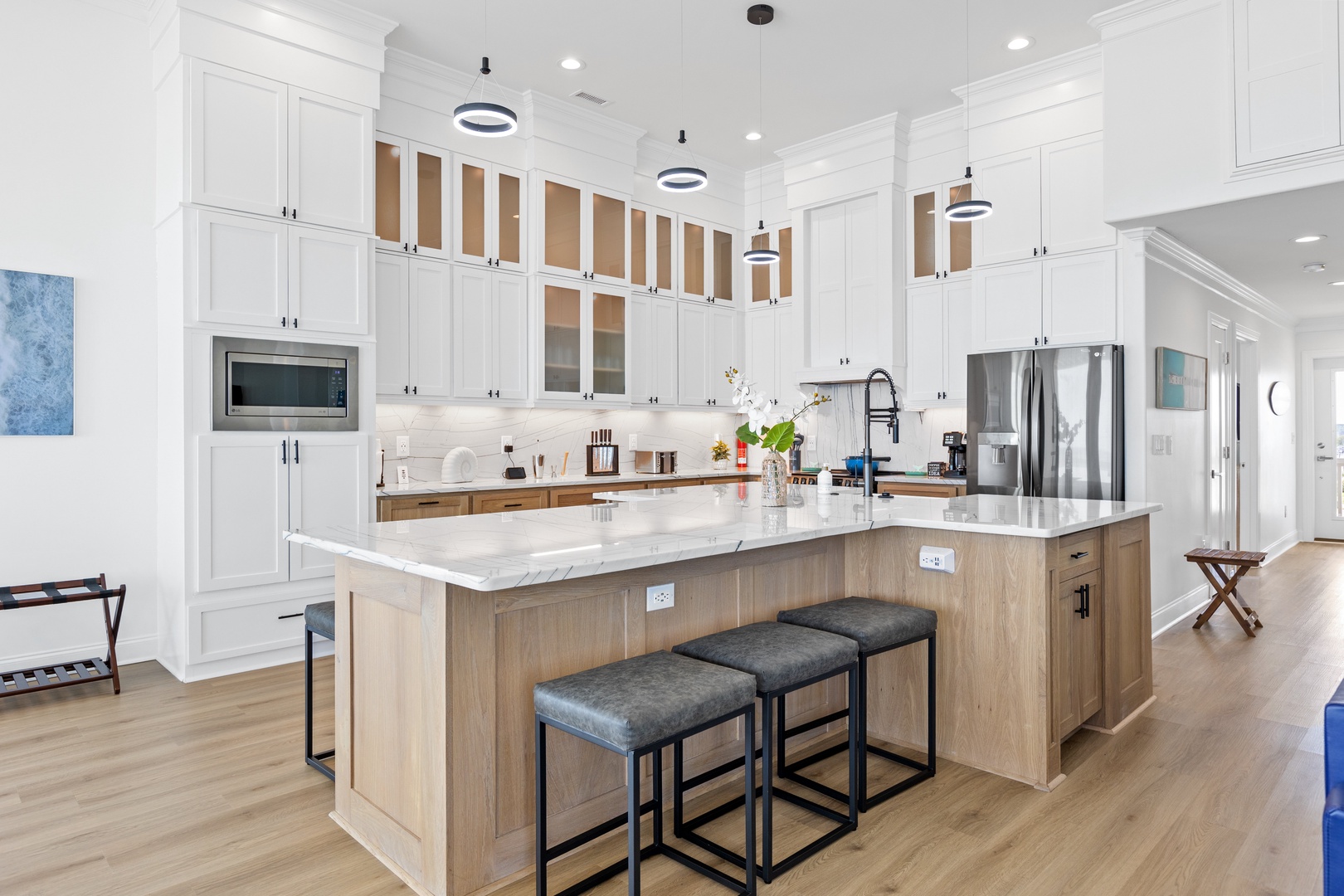 The well-stocked kitchen with countertop seating for 6