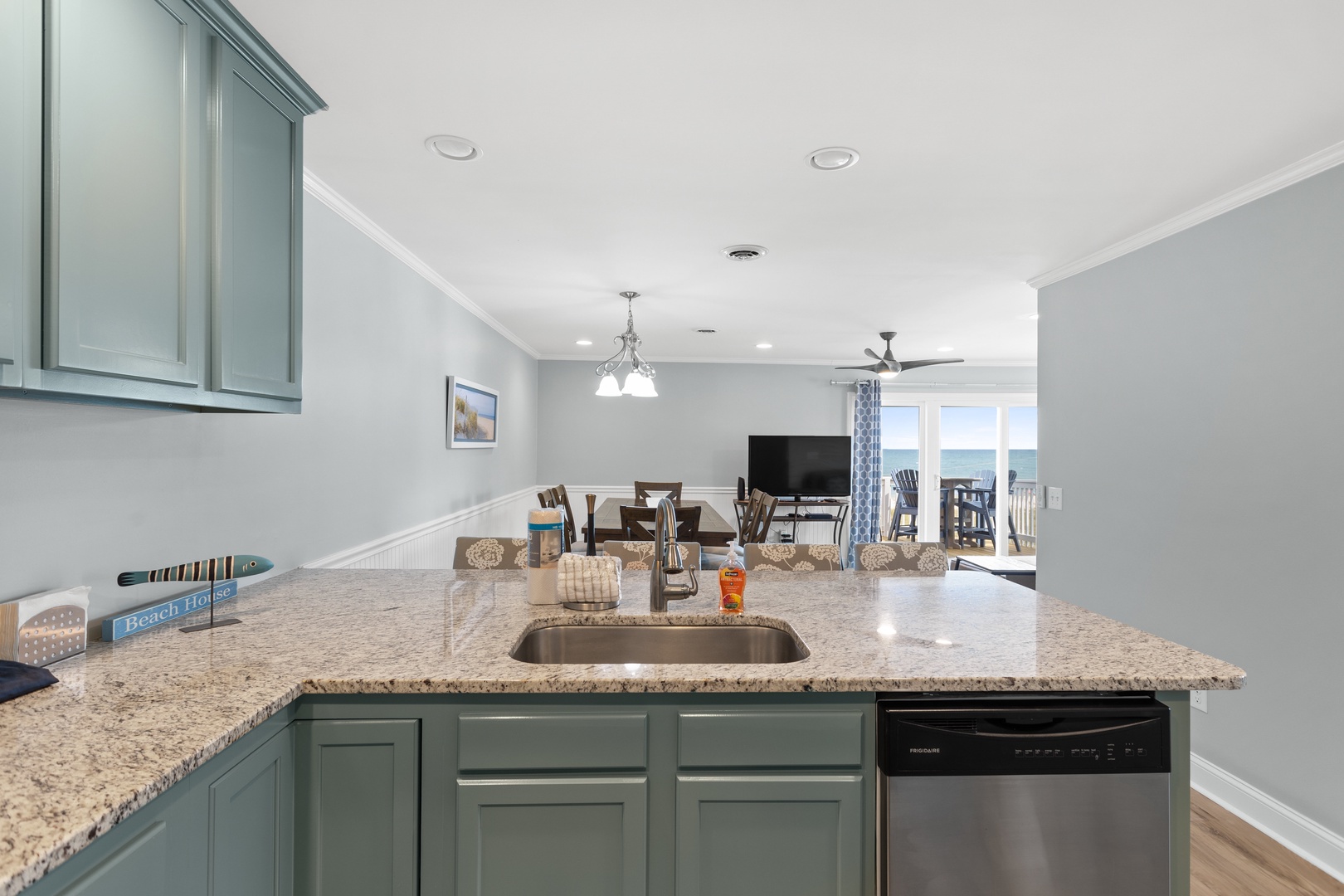 The well-stocked kitchen with countertop seating for 4
