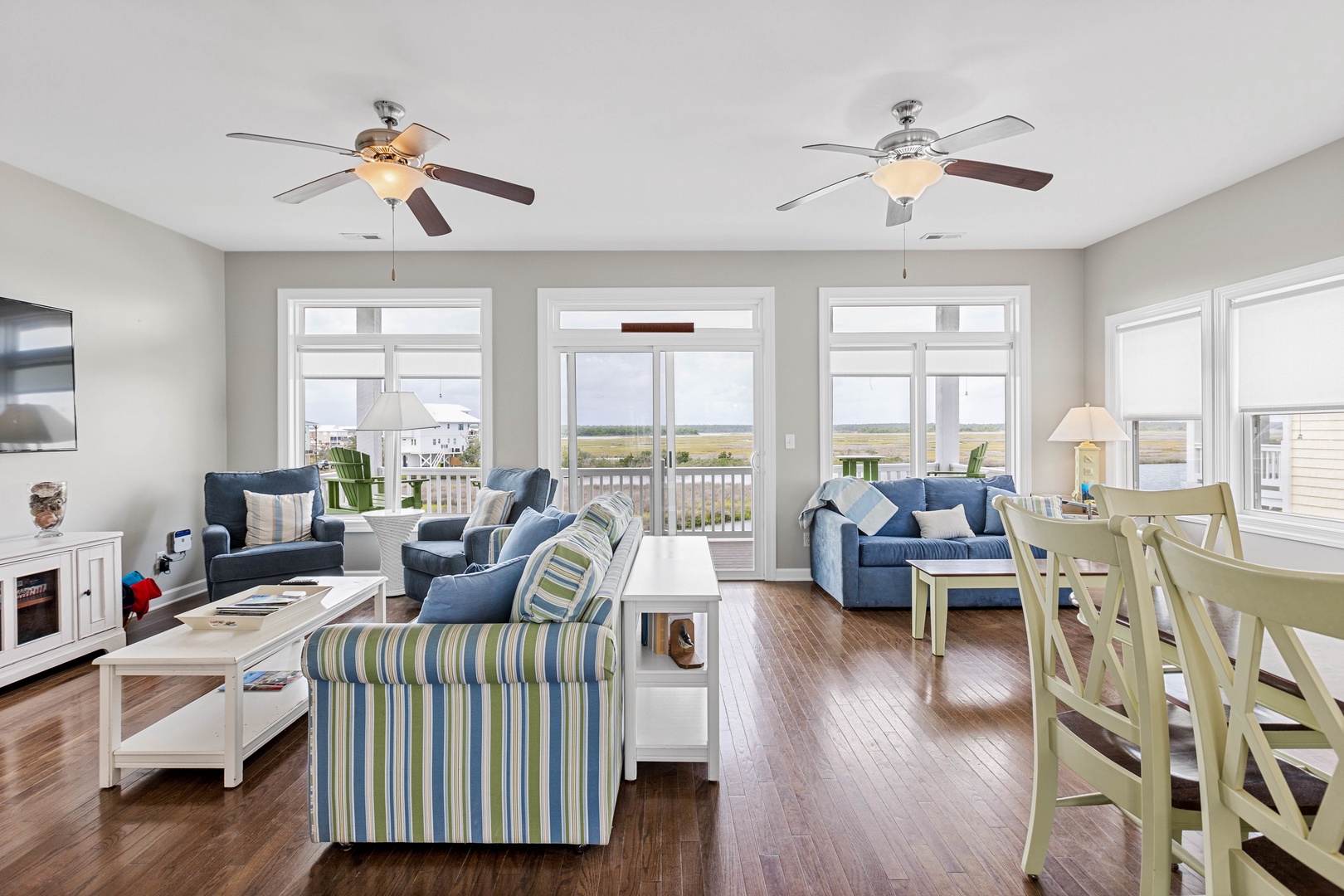 The open living area with a Smart TV and covered porch access