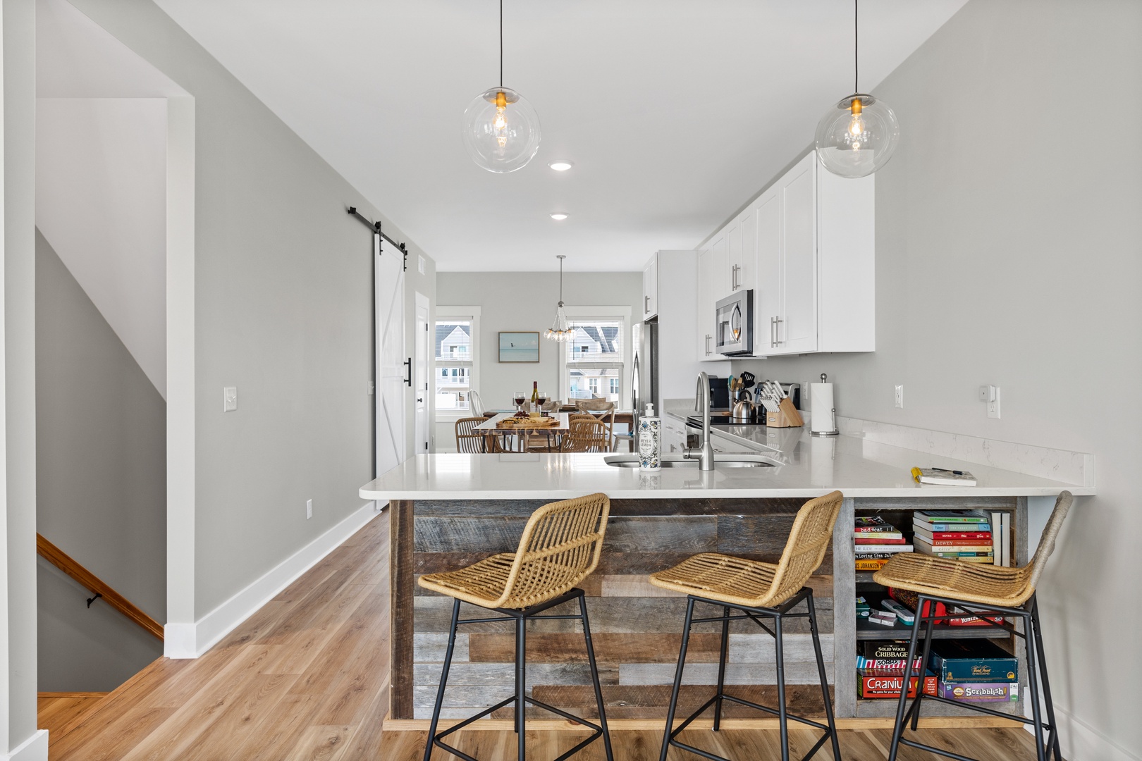 The well-stocked kitchen with countertop seating for 3 and island seating for 2