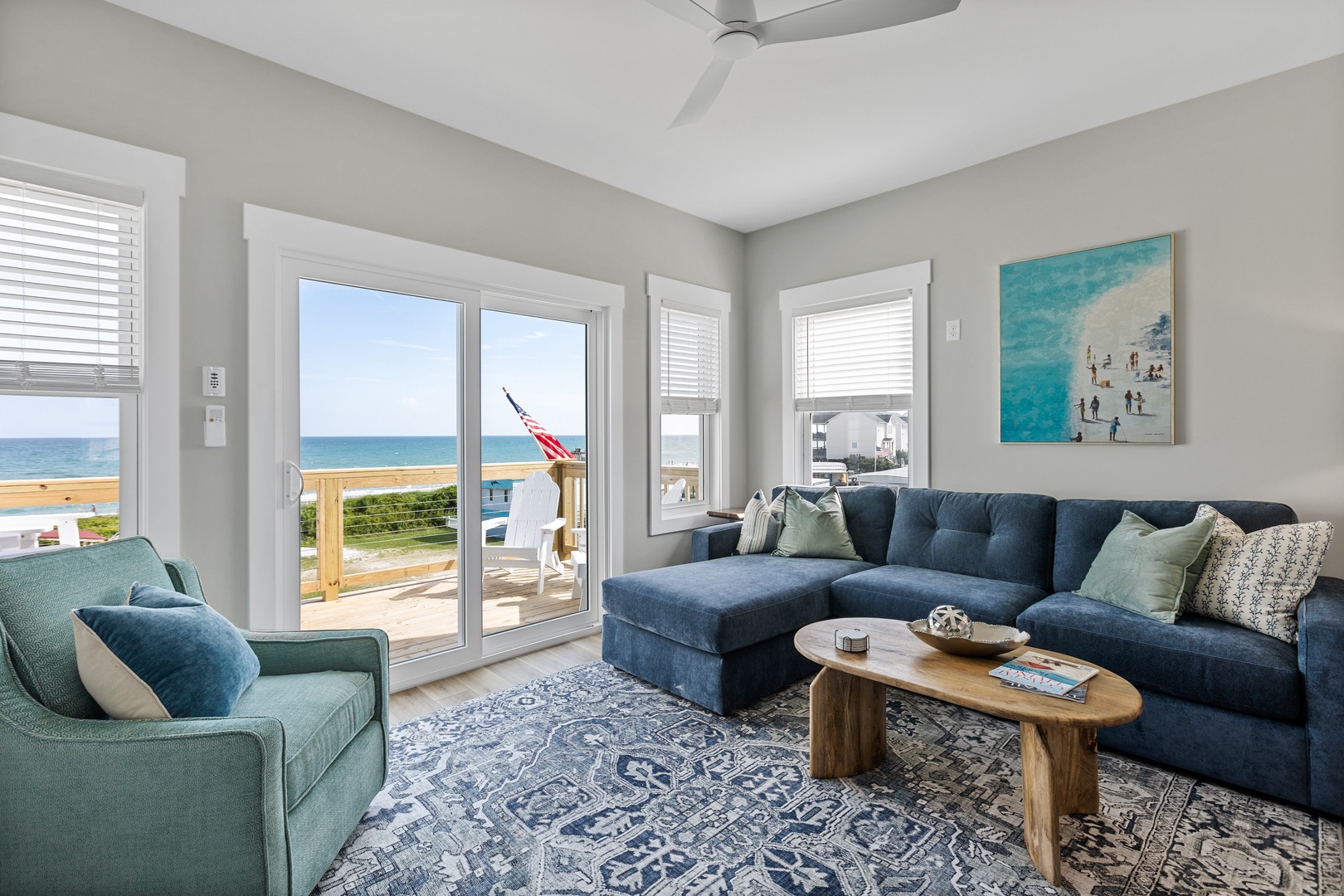 The living area with comfortable seating, a Smart TV, and top-floor balcony access