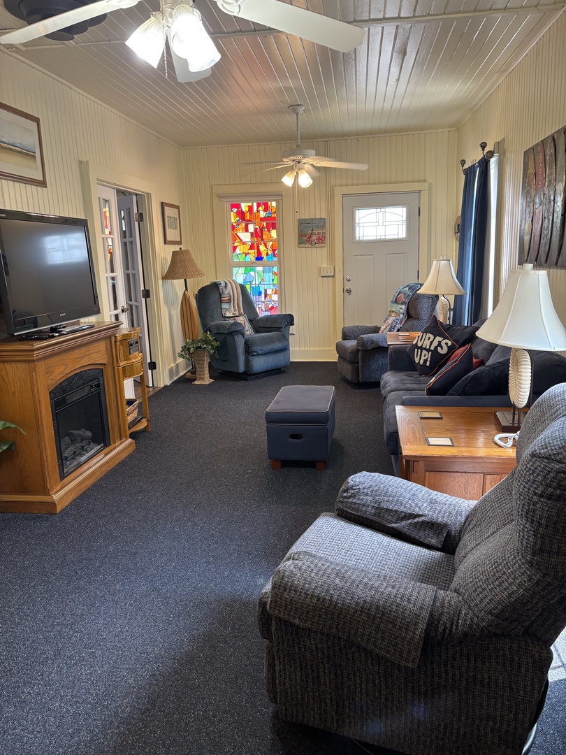 Unwind in your cozy living space with plush seating, vaulted ceilings, and warm wood details—a perfect retreat for game nights or quiet evenings after exploring the area.