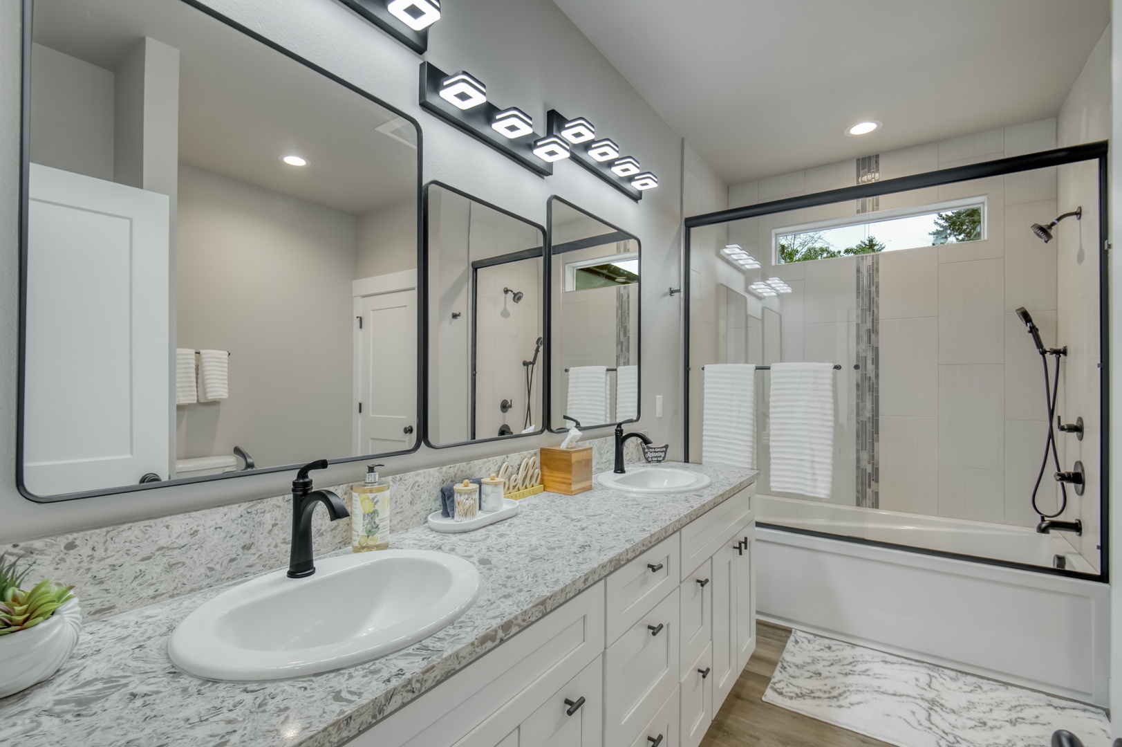 Primary bathroom. Quartz counters, double sink, large tub/shower.
