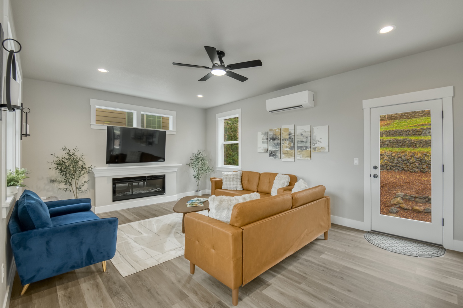 Down stairs living room with smart TV on swivel mount. Electric fire place.