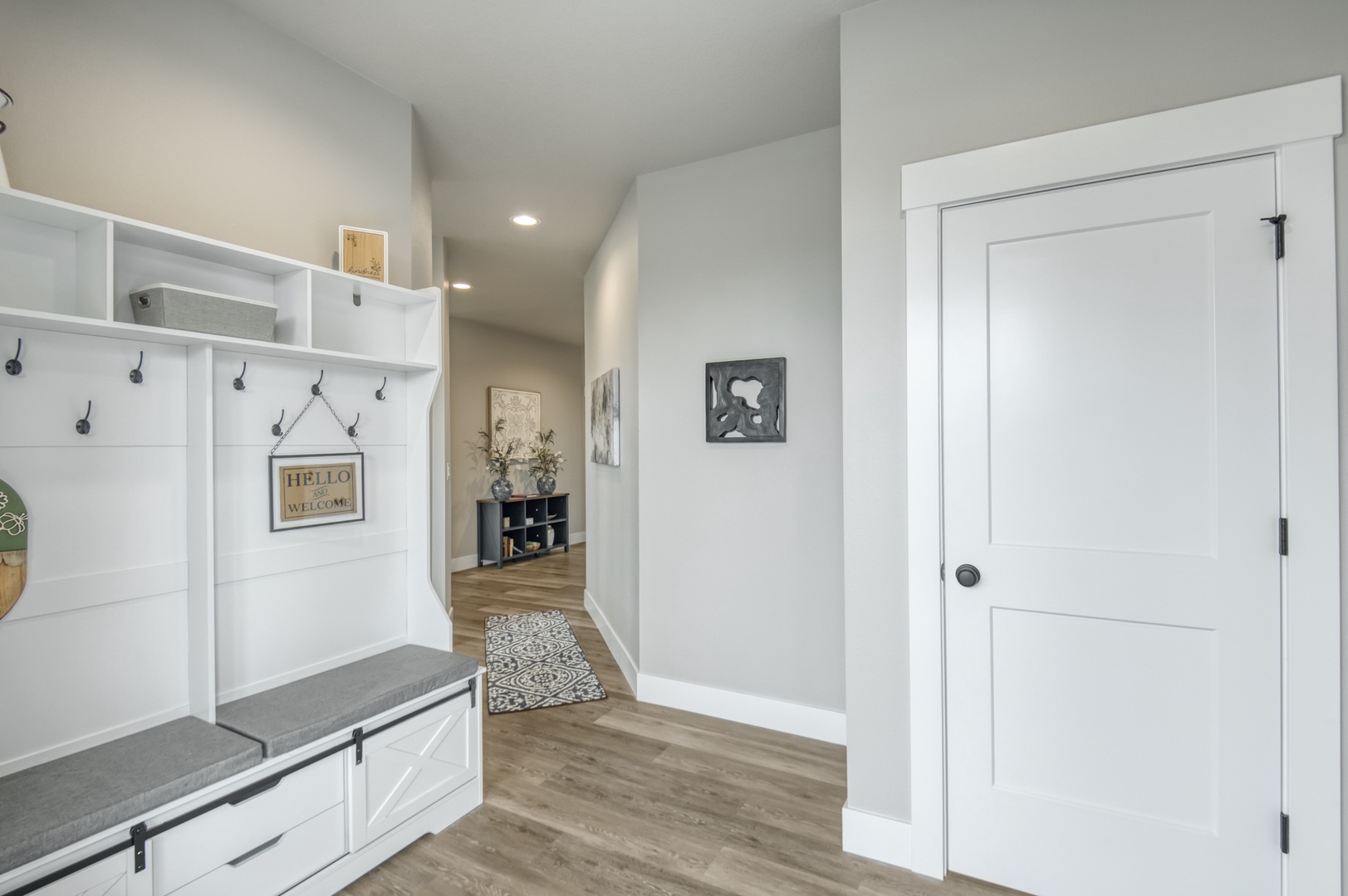 Your welcoming entry greets you with organized storage cubbies and hooks for coats.