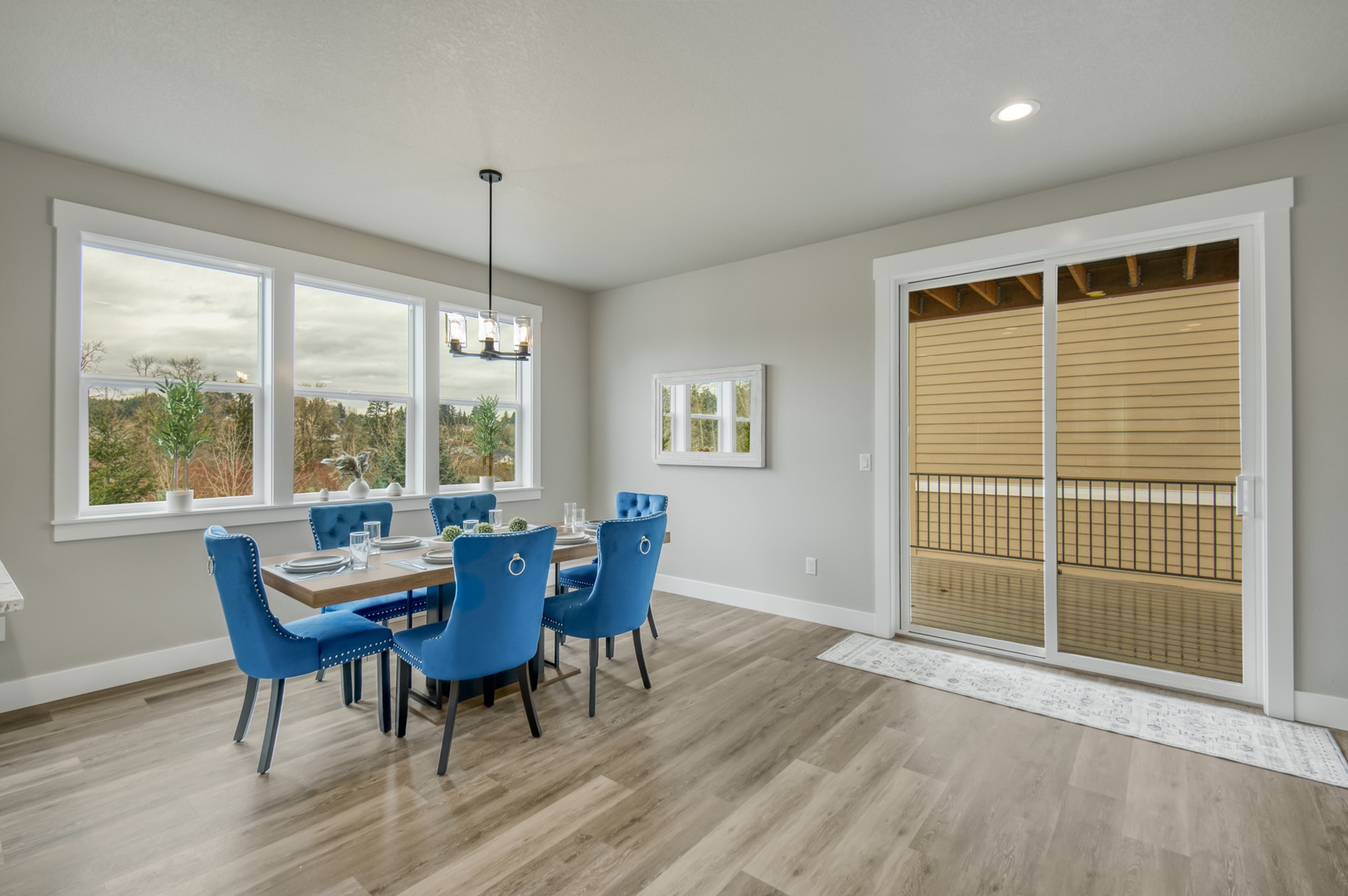 Enjoy dinner with a view where natural light flows through large windows and opens to your private balcony retreat.