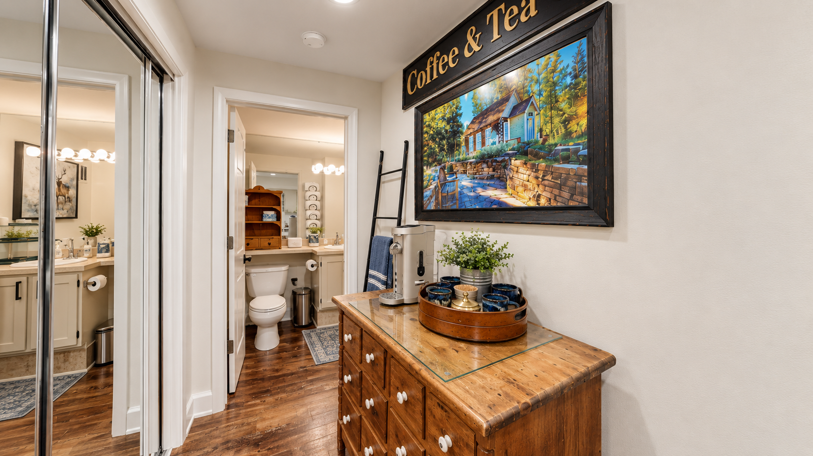 A thoughtfully arranged hallway welcomes you with warm wood tones and homey touches, leading to private bathrooms designed for your comfort.