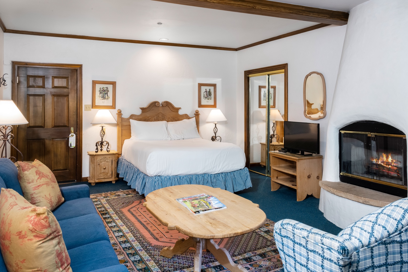 Sink into comfort in your private retreat, where rustic wood beams meet soft linens and a crackling fireplace invites relaxation after a day of adventure.