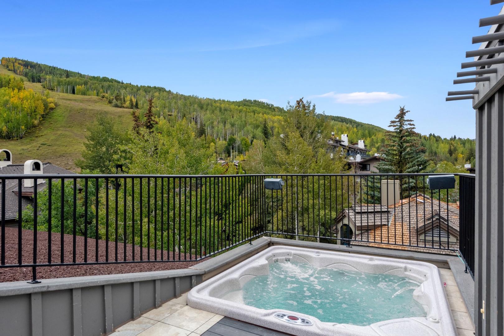 Your private balcony hot tub awaits, with sweeping mountain views and aspens swaying in the breeze—perfect for soaking under open skies after a day exploring the slopes.