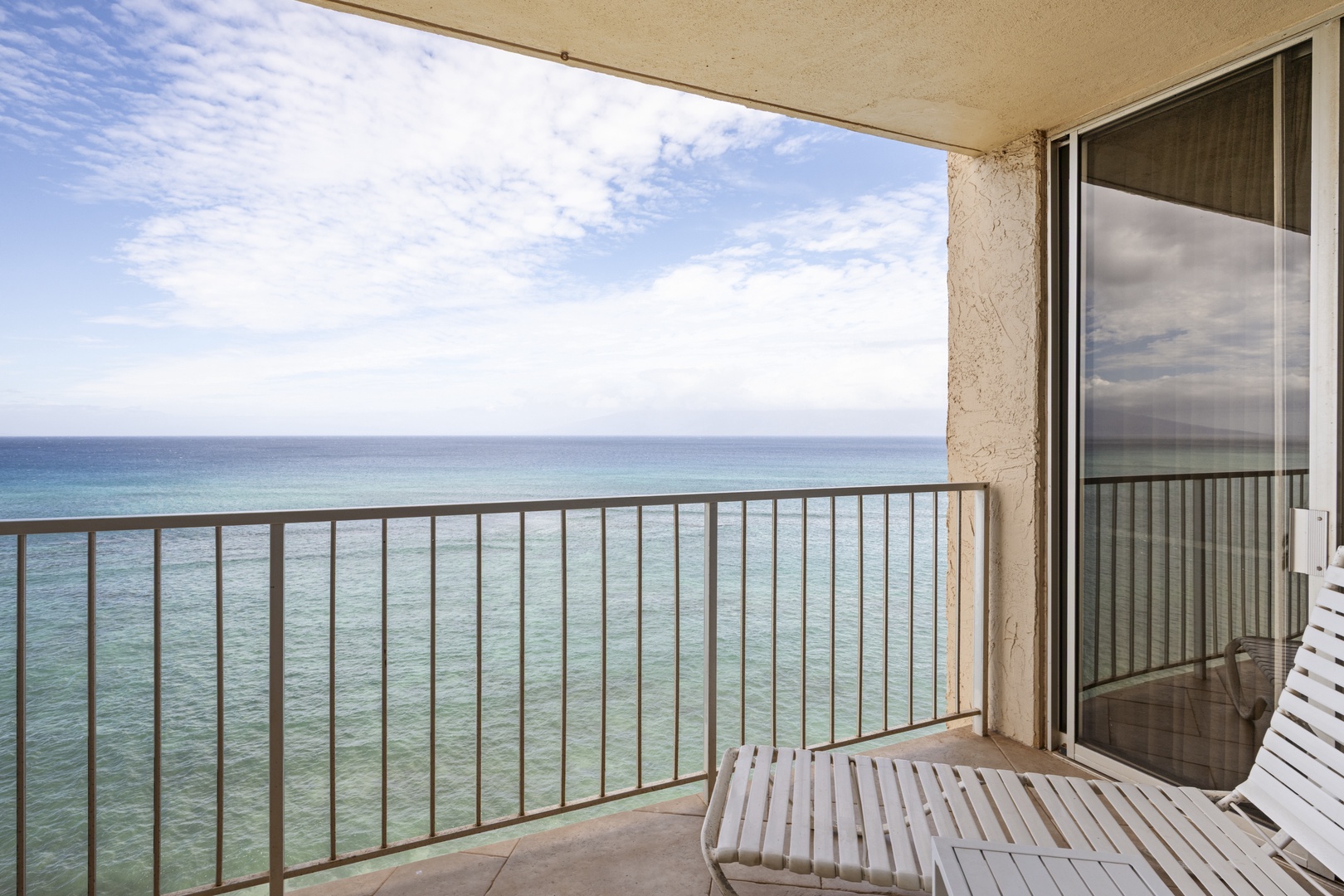 Step onto your private balcony and breathe in the ocean breeze while watching endless turquoise waters stretch to the horizon.