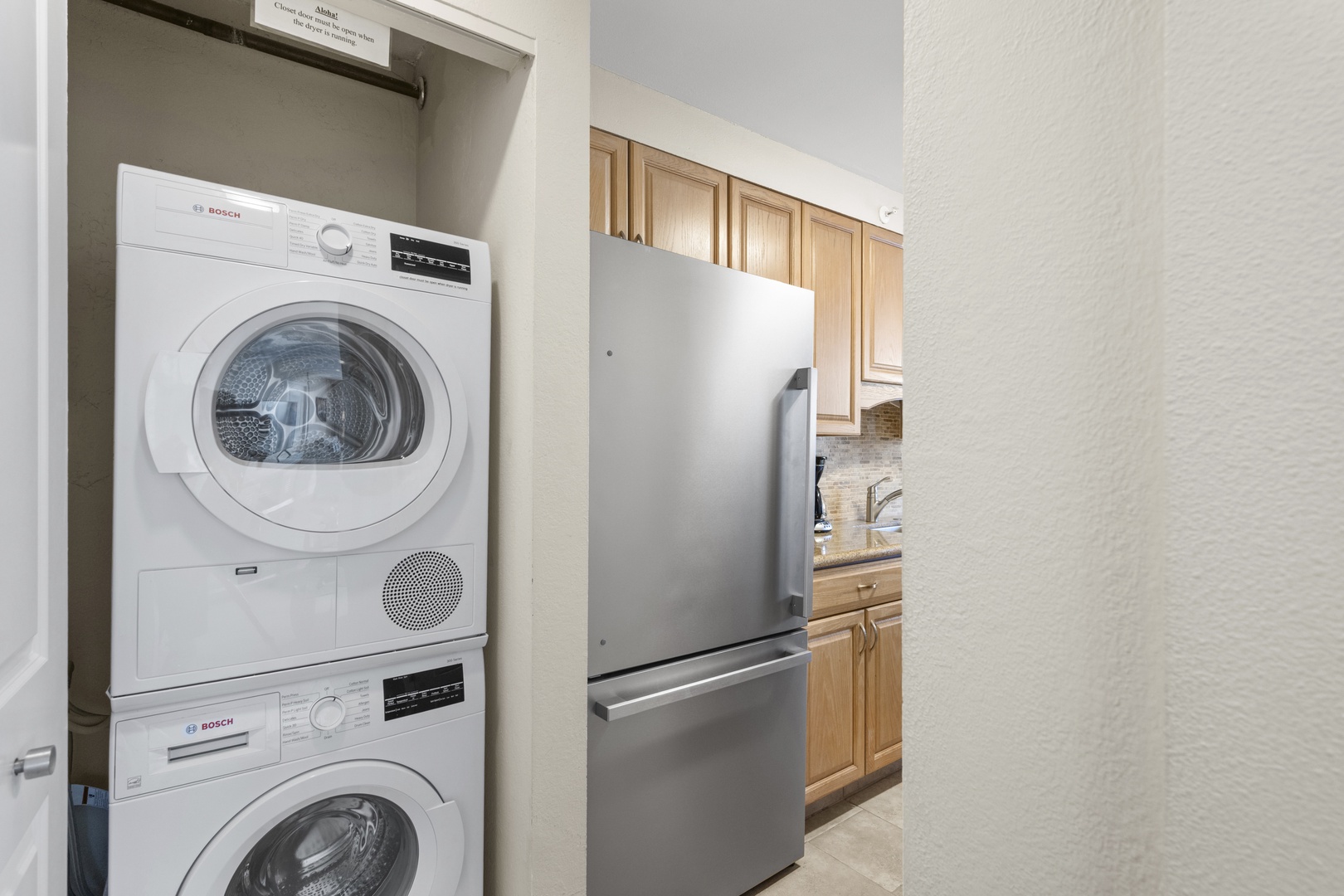 Keep your clothes fresh with these convenient in-unit washer and dryer, stacked neatly in your private laundry closet.
