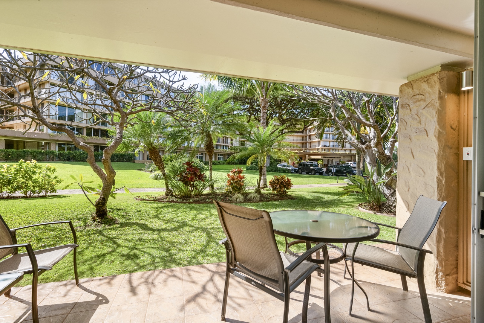 Step onto your private patio where lush tropical gardens and swaying palms invite you to unwind with morning coffee or evening relaxation in paradise.