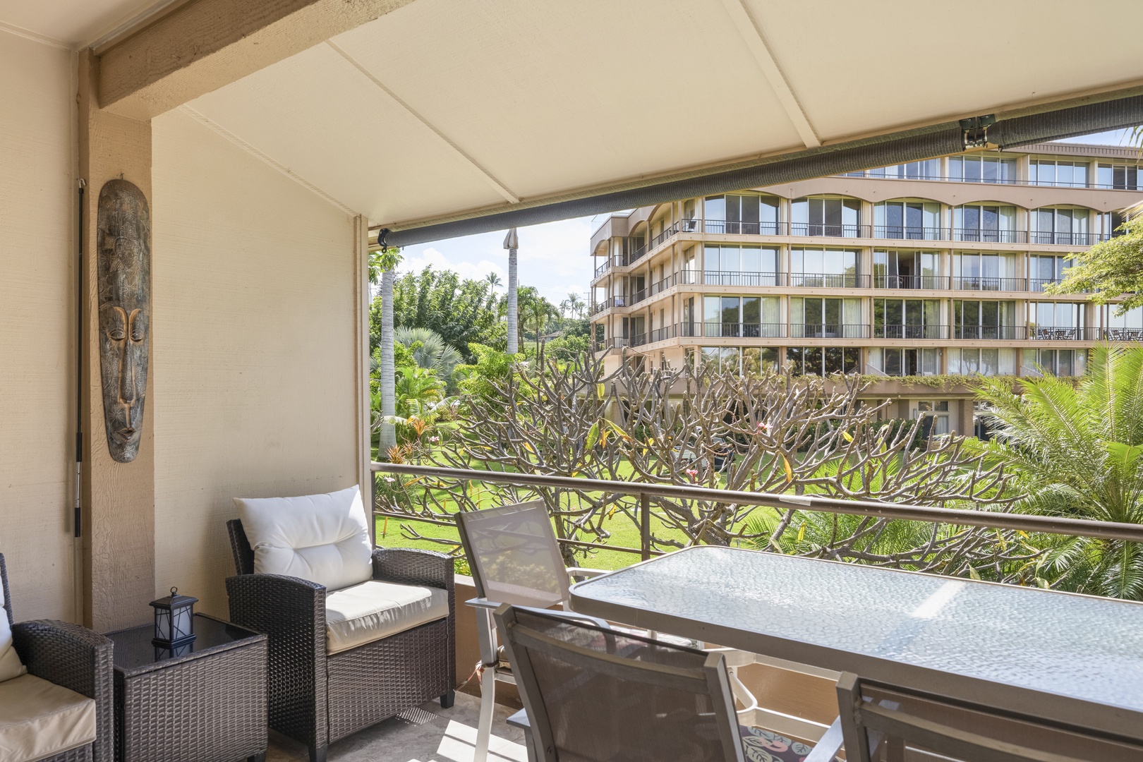 Relax on your private covered terrace with garden and city views, perfect for morning coffee or evening meals surrounded by lush tropical greenery and modern comfort.