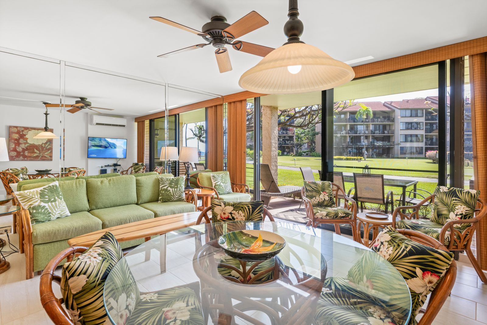 Relax in your spacious, tropical-inspired living area with lush garden views just steps from your private patio. Natural light, island-style furnishings, and a cool breeze welcome you home.