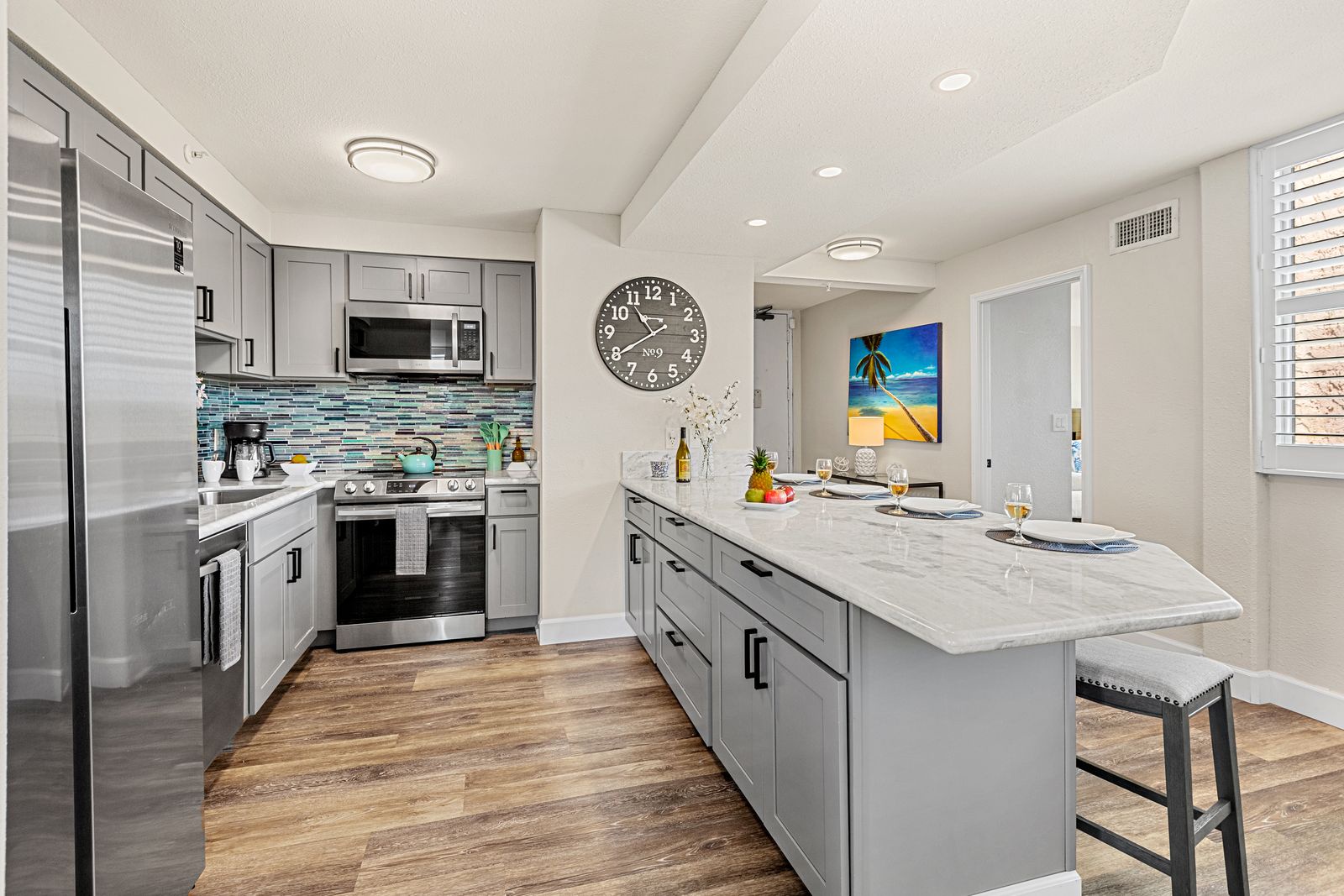 Your fully equipped kitchen features modern appliances and a spacious island where you can prep meals or enjoy casual dining together.