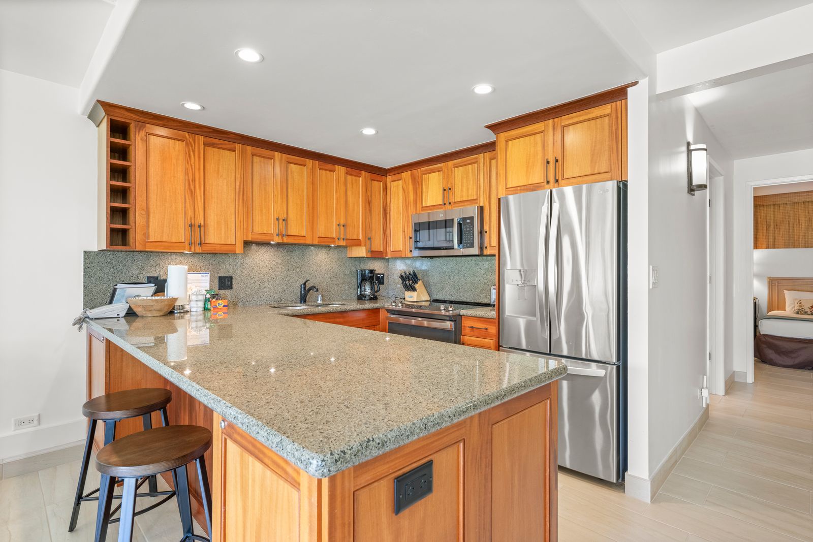 Step into your fully equipped kitchen with gleaming granite countertops, stainless steel appliances, and plenty of cabinet space to make your vacation meal prep a breeze.
