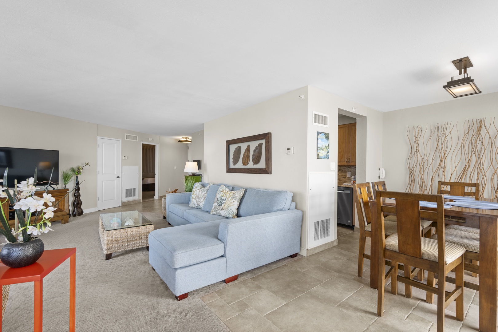 Relax in your spacious living area with comfortable seating, modern décor, and seamless flow to your dining space.