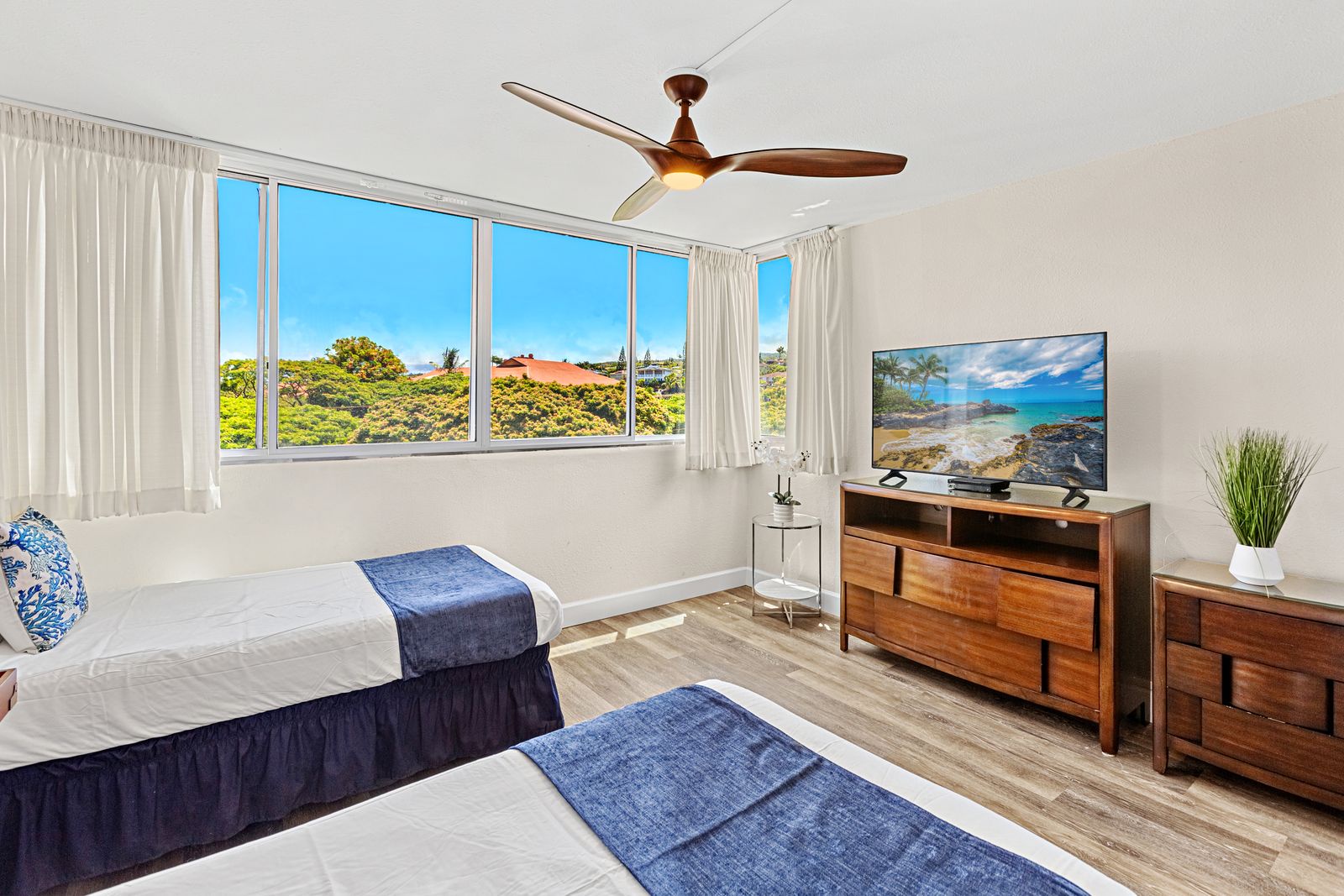 Wake up to stunning garden views from your comfortable twin beds, with modern amenities and tropical scenery right outside your window.
