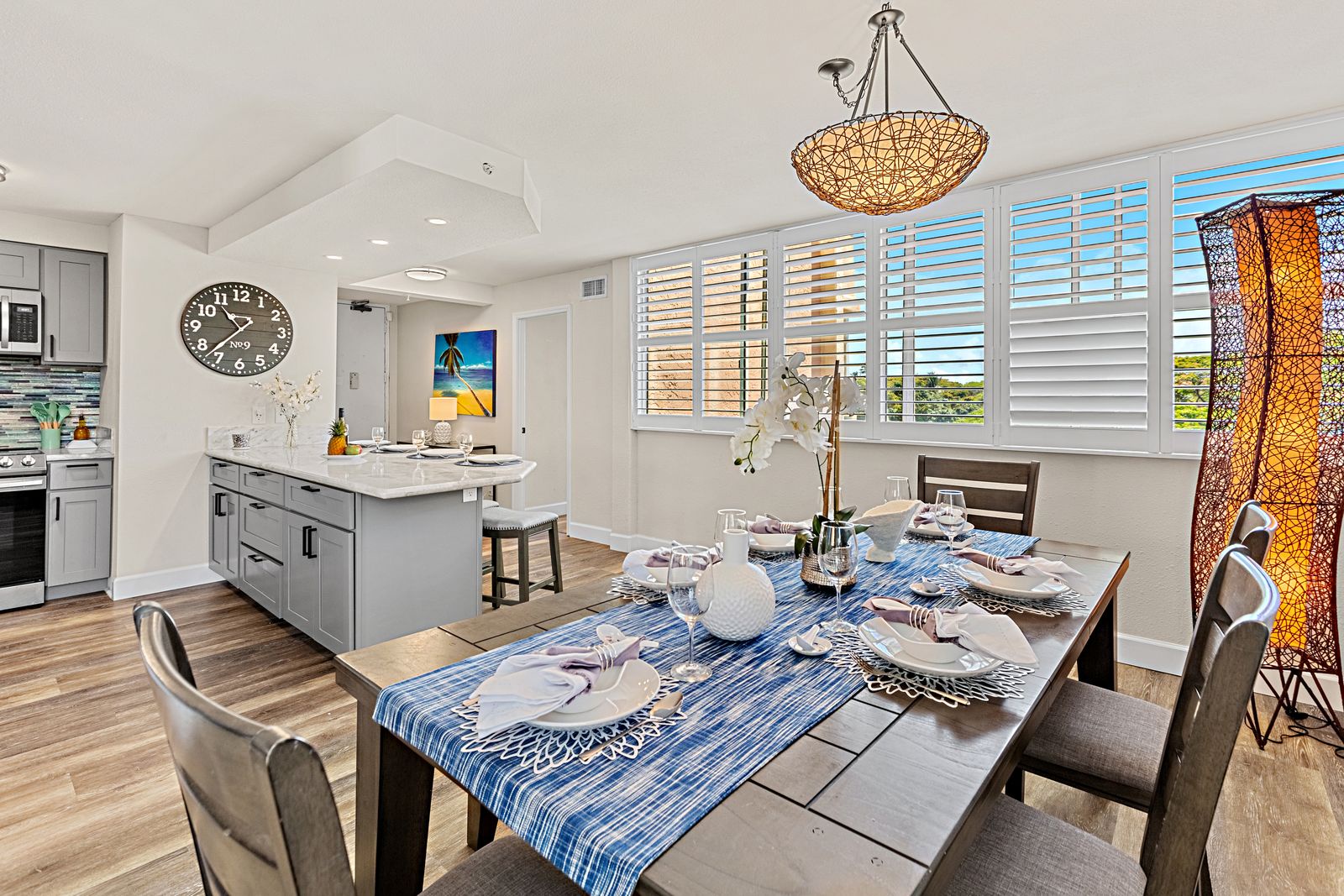 Your open-concept kitchen and dining space features modern appliances, elegant lighting, and large windows that flood the area with natural light.