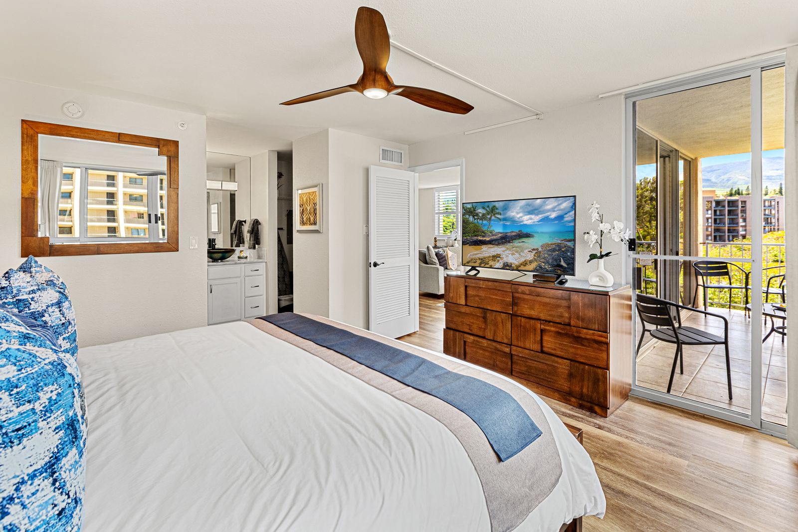 Unwind in your stylish retreat with tropical vibes, modern comforts, and a private balcony overlooking the vibrant cityscape.