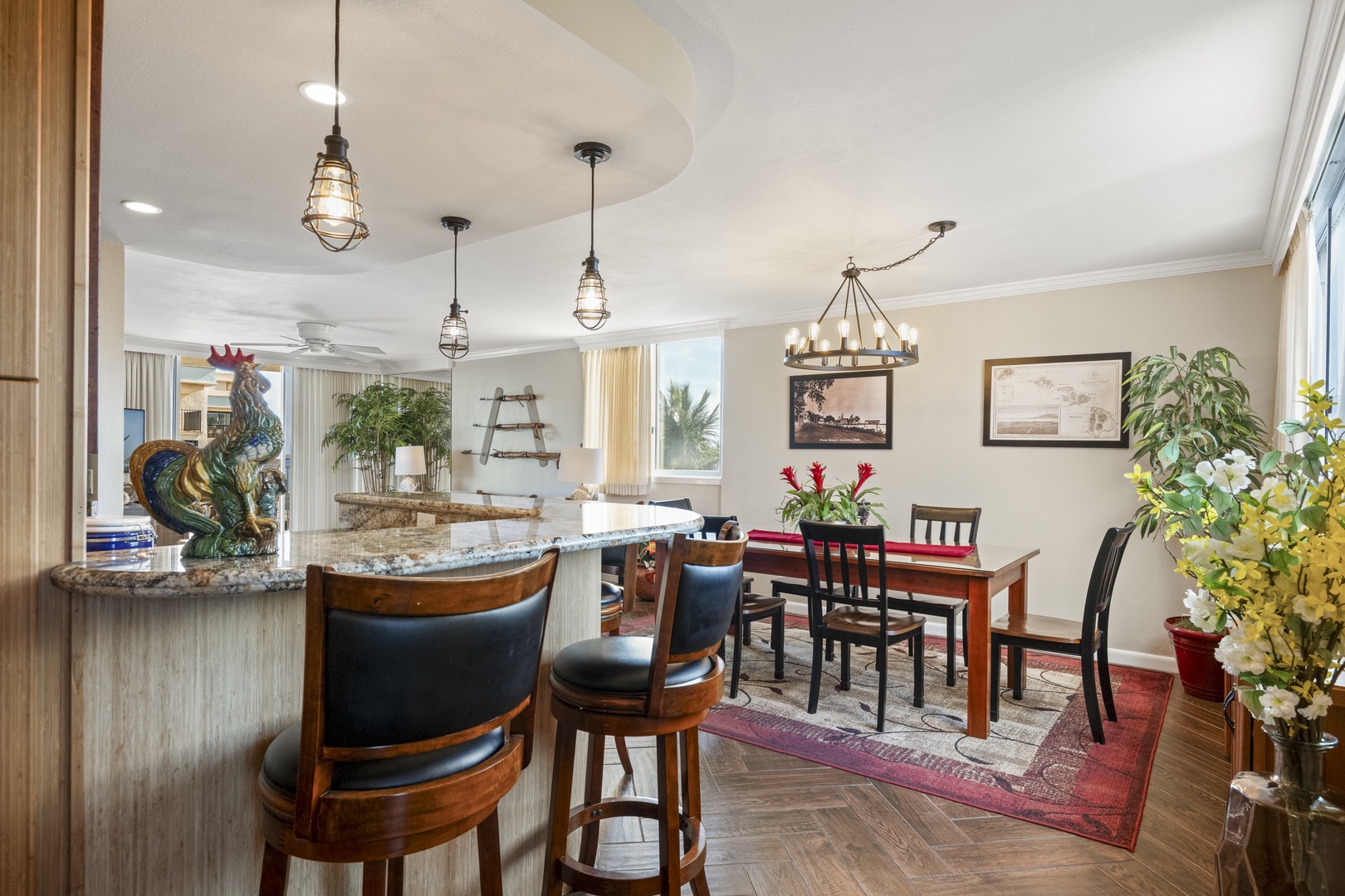 Settle in at the curved breakfast bar or gather around the dining table, where warm woods and nautical lighting create your perfect spot for morning coffee or evening meals together.