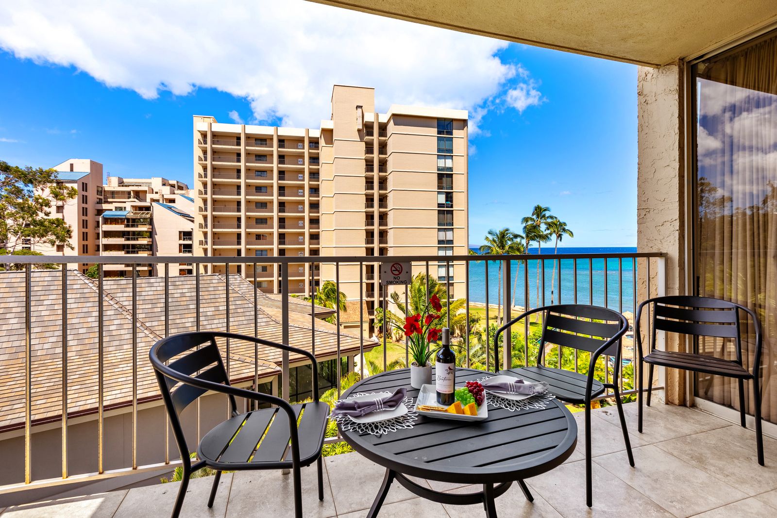 Sip your morning coffee while watching ocean waves from your private balcony, perfectly set up for relaxing with stunning blue water views.