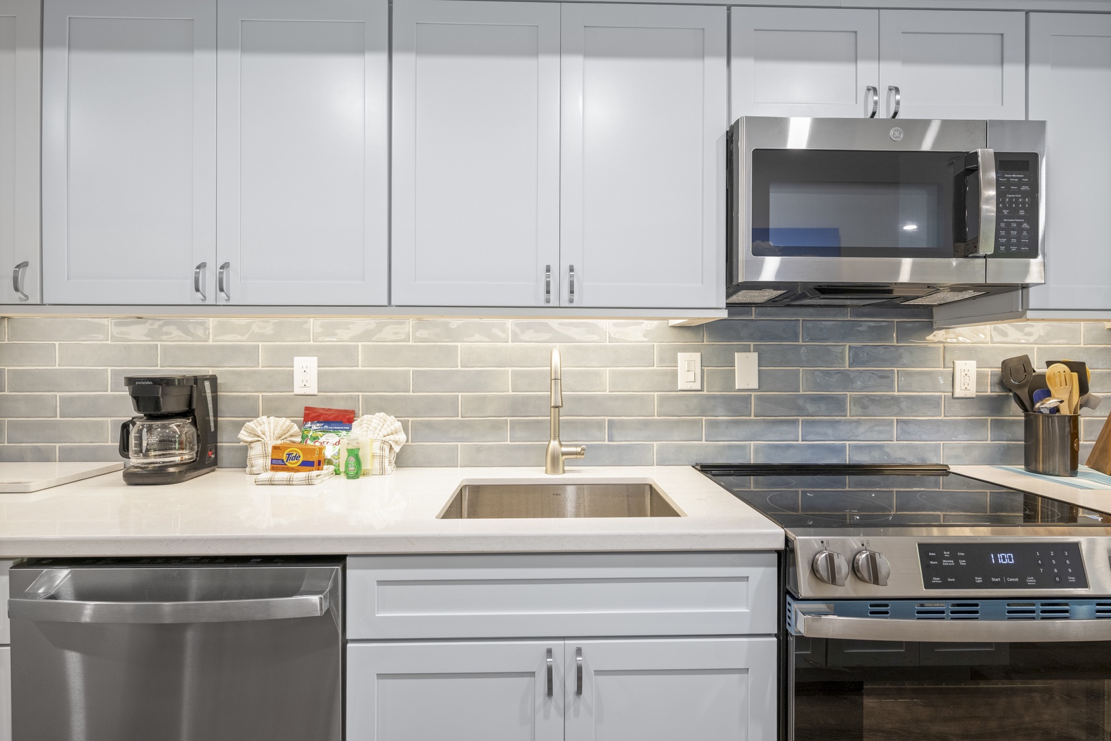 Your modern kitchen offers sleek stainless appliances and crisp white cabinetry, making meal prep a breeze during your stay.