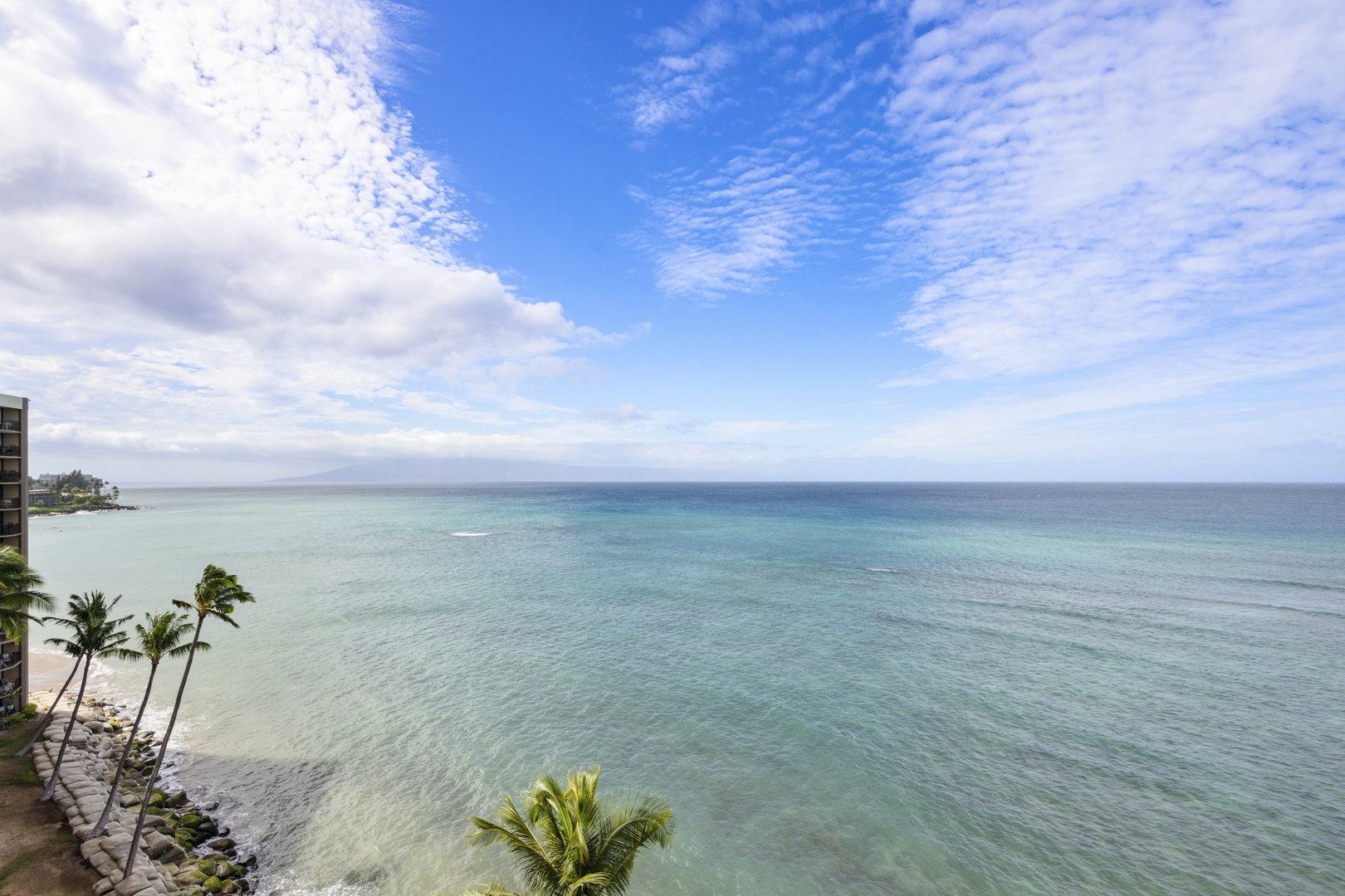 Stunning oceanfront location with pristine turquoise waters and swaying palm trees creating the perfect tropical paradise setting.