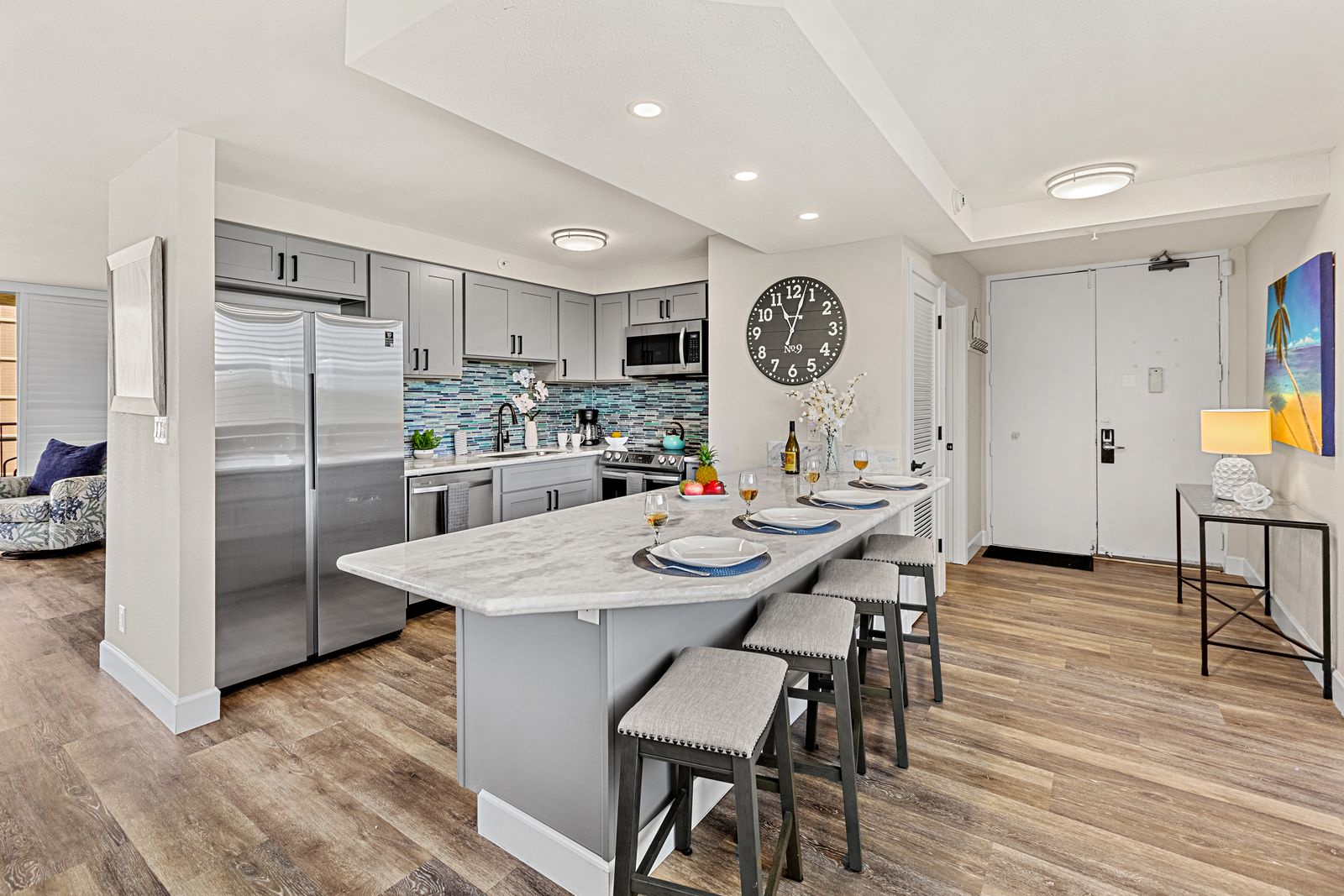 Cook memorable meals in your sleek modern kitchen, featuring granite countertops, stainless steel appliances, and a breakfast bar for casual dining.