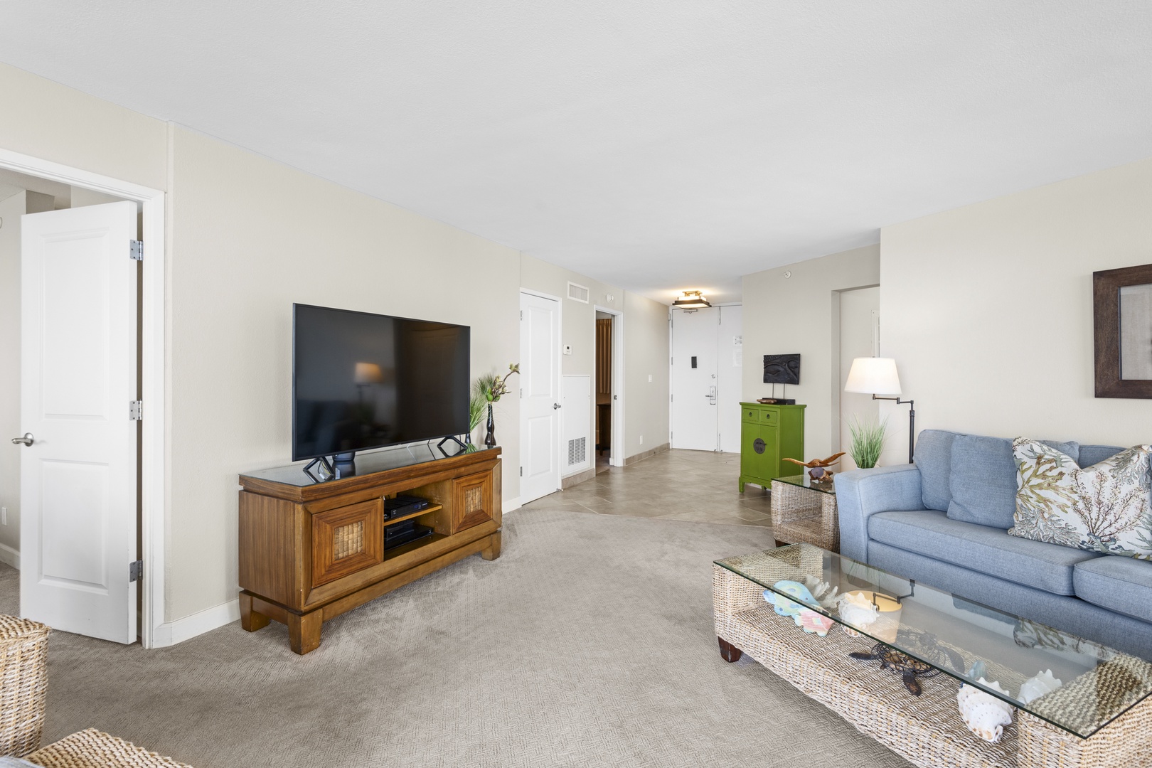 Unwind in your spacious living room with plush seating, modern TV, and thoughtful touches that make you feel right at home.