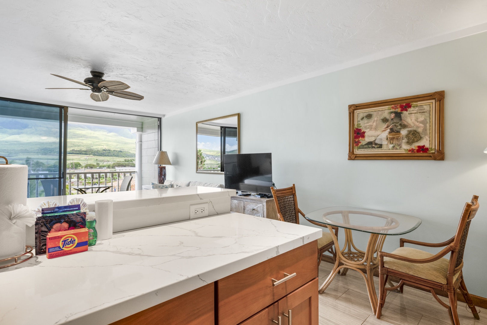 Step into your bright, airy living space where ocean views frame your island escape. Unwind on comfy seating, enjoy meals at the cozy dining nook, and feel the tropical breeze.