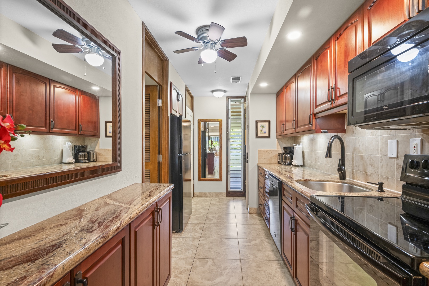 Your fully equipped kitchen features elegant wood cabinetry, granite countertops, modern appliances, and plenty of space to prepare delicious meals during your stay.