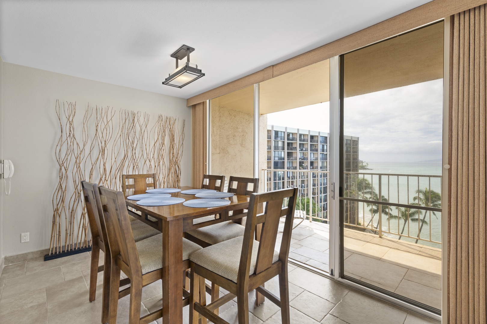 Your elegant dining space flows onto a private balcony with stunning ocean views, where every meal becomes a memorable experience.