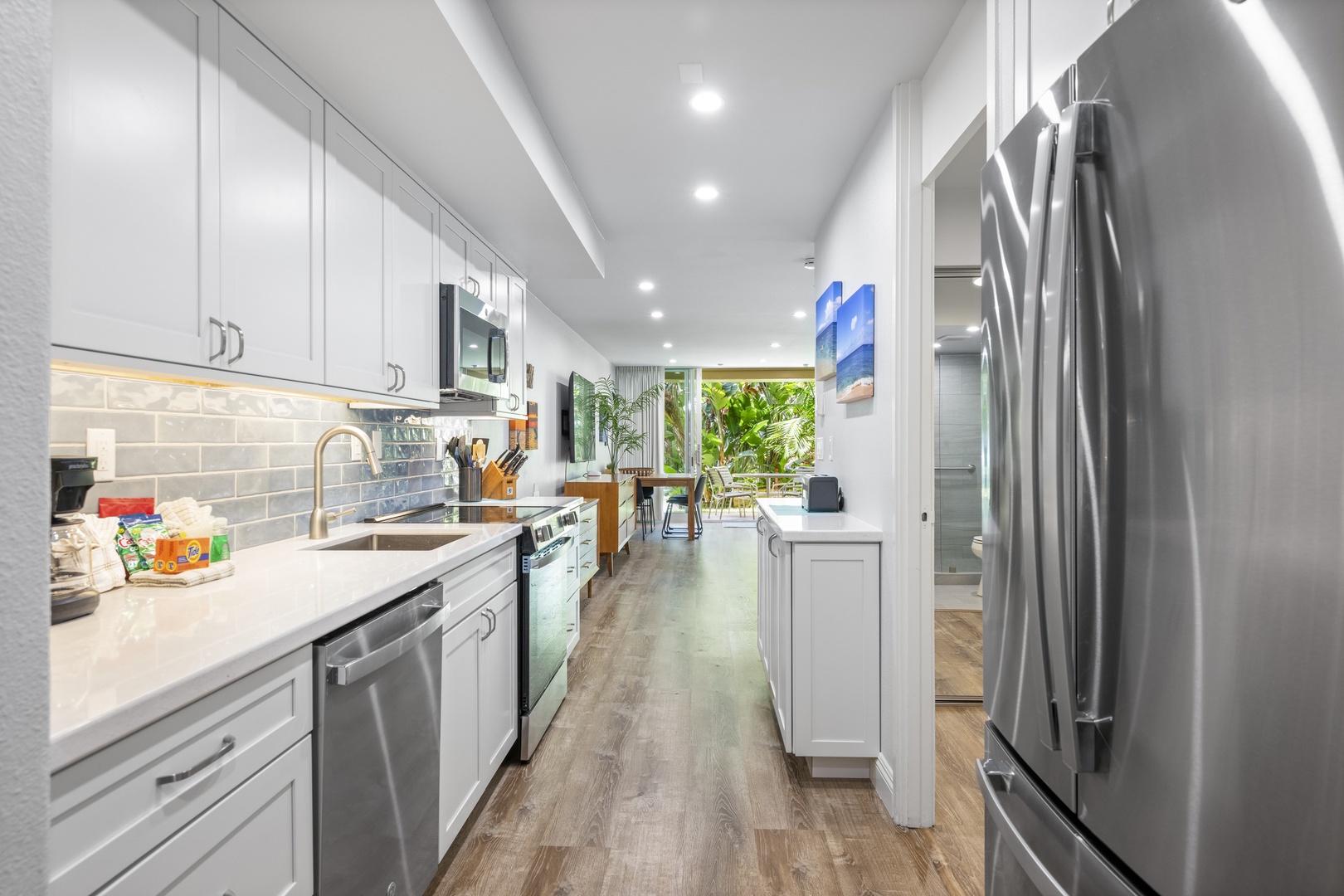 Your home away from home features a sleek, modern kitchen with stainless steel appliances and pristine countertops, ready for you to create memorable meals during your stay.