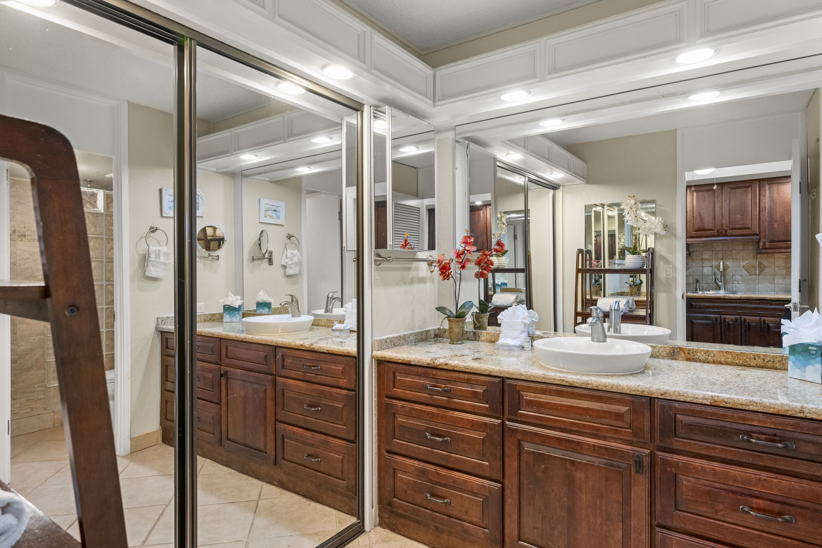 Step into your luxurious en-suite with dual vanities, gleaming granite counters, and elegant vessel sinks—perfect for morning routines side by side. Ample storage and thoughtful lighting make every moment feel effortlessly refined.