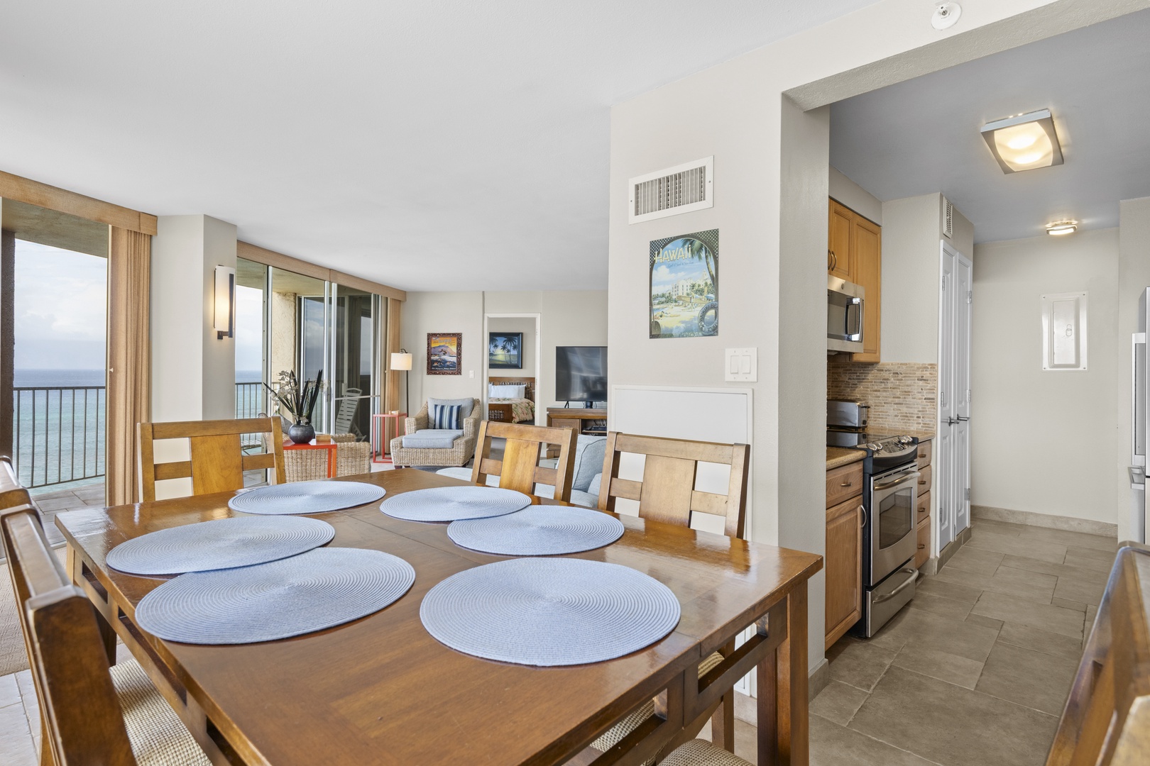 Your oceanfront dining table awaits memorable meals with stunning sea views through floor-to-ceiling windows.