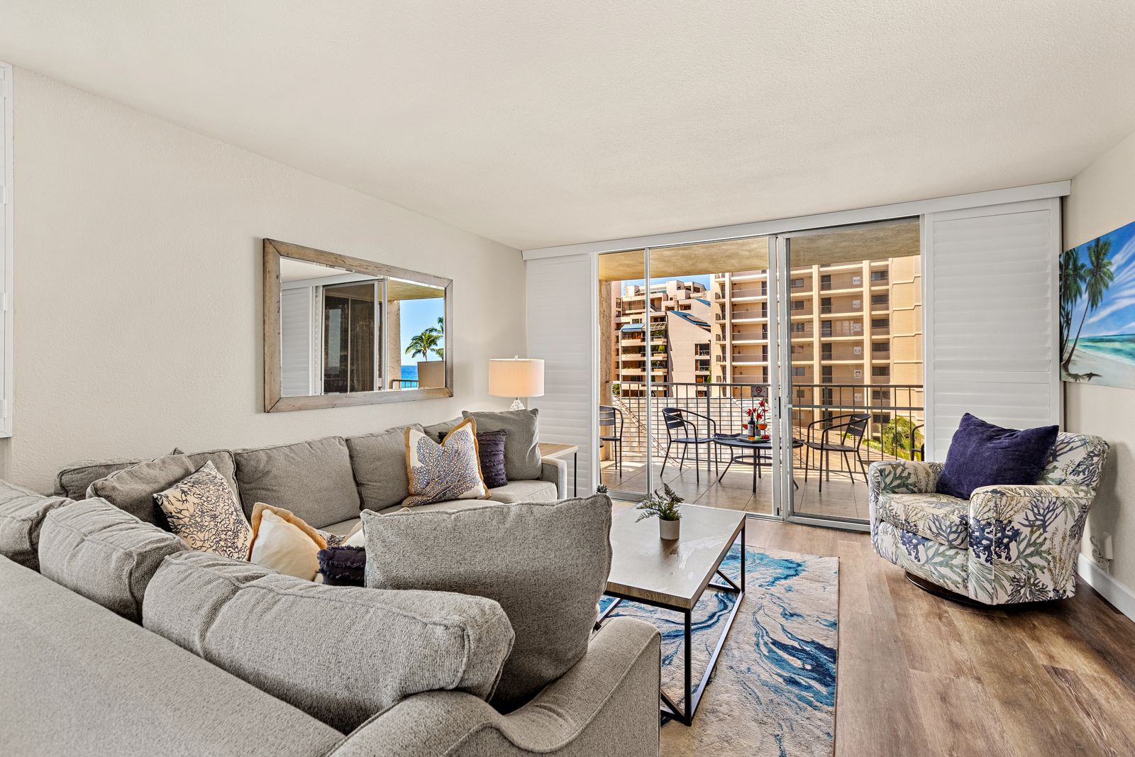 Unwind in your stylish living room with plush sectional seating and step onto your private balcony overlooking the vibrant cityscape.